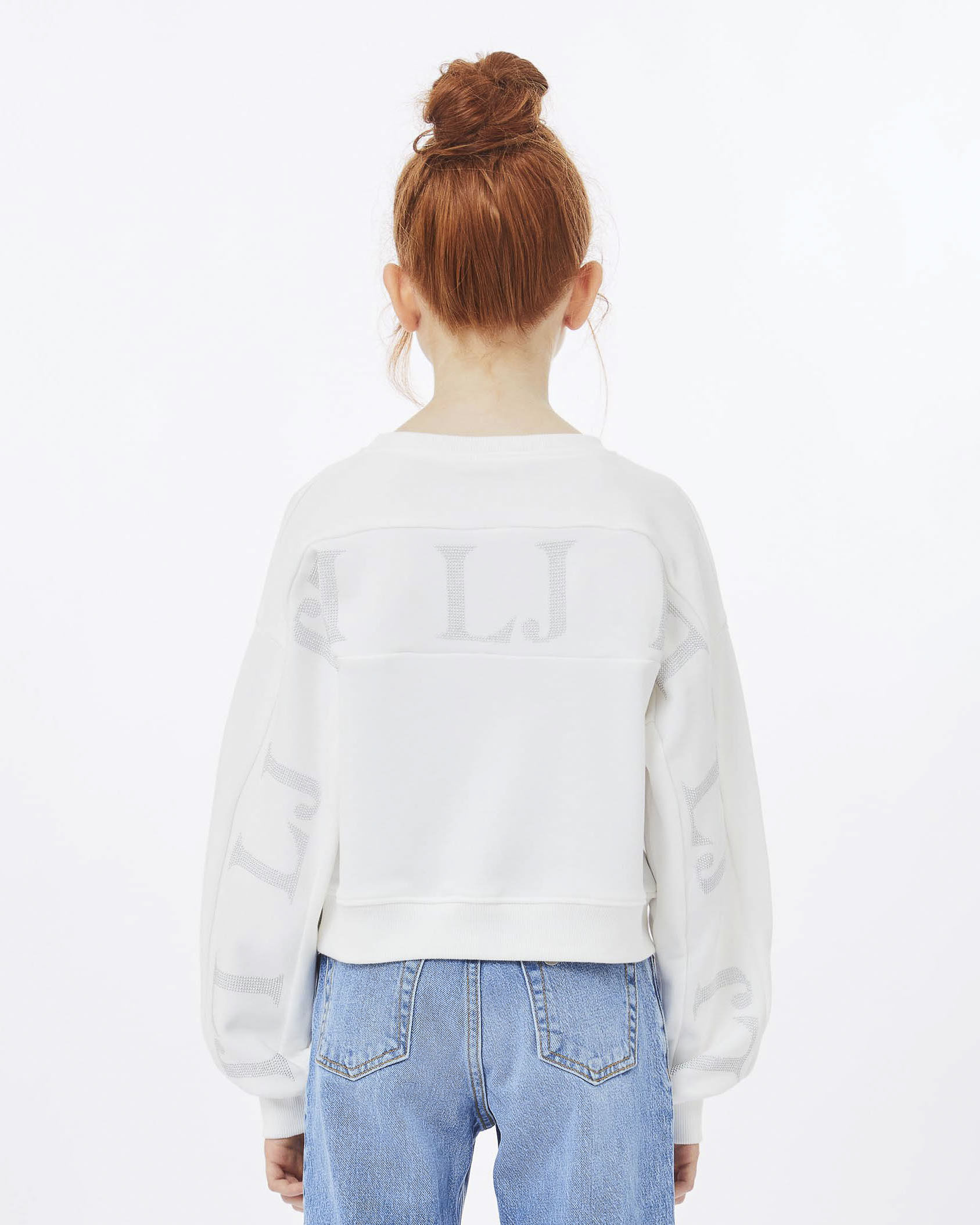 Felpa bianca over con inserto a fascia porta logo a borchie sul retro image