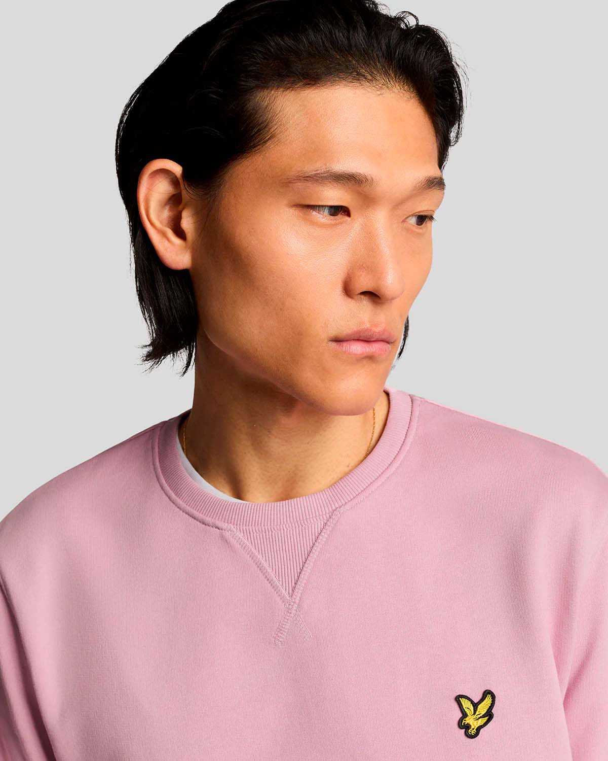 Felpa rosa girocollo in cotone con logo aquila gialla sul petto