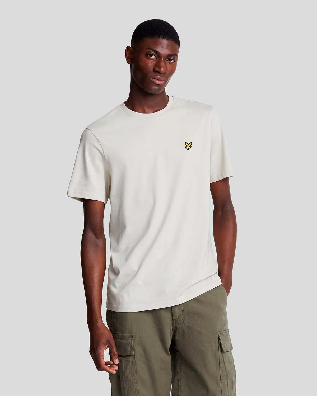 T-shirt mezza manica beige in cotone con logo aquila gialla ricamata sul petto