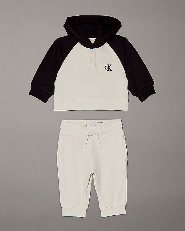 Tuta bicolore panna e nera in cotone stretch