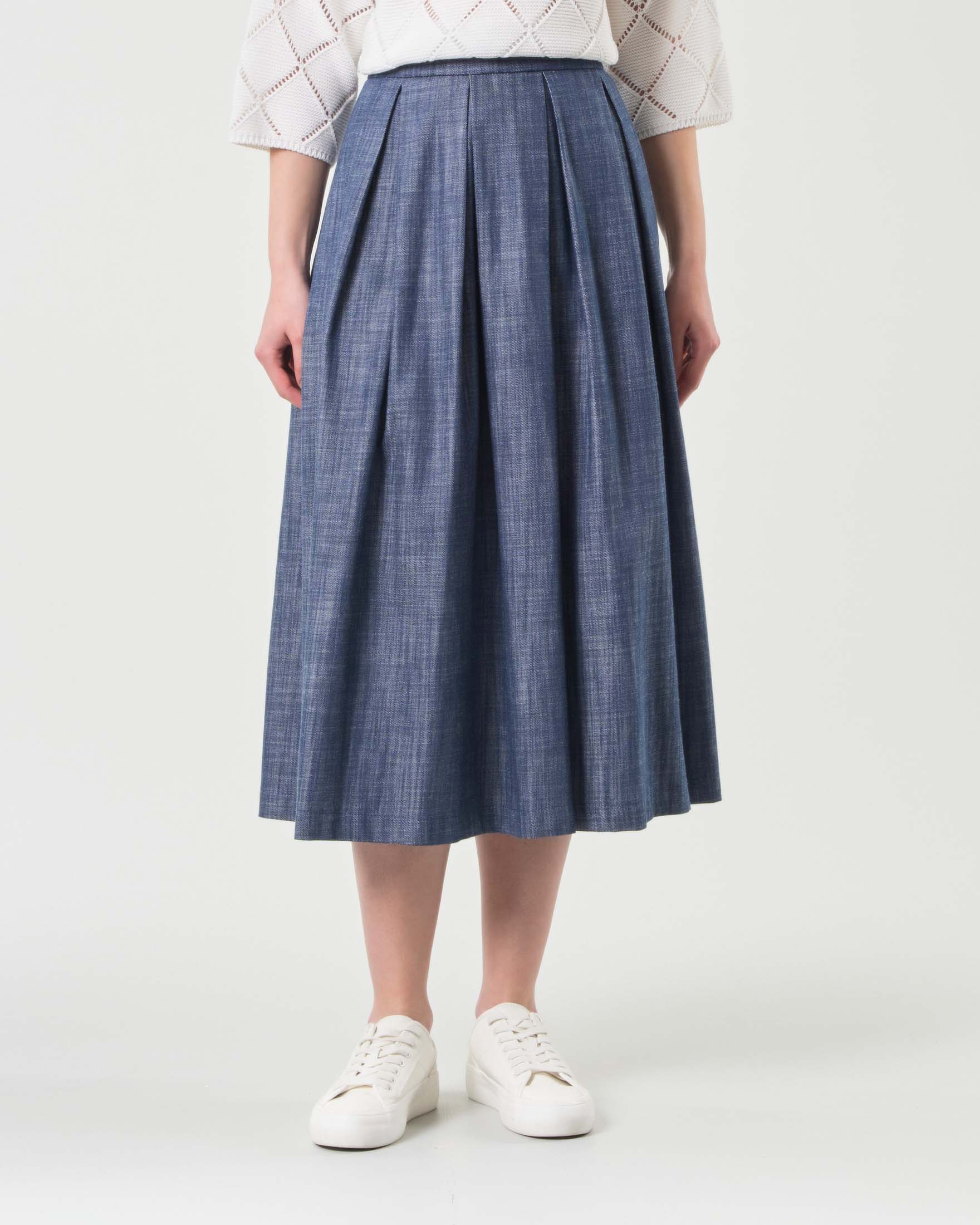 Gonna midi in denim blu fiammato in cotone dalla linea ampia con faldoni image