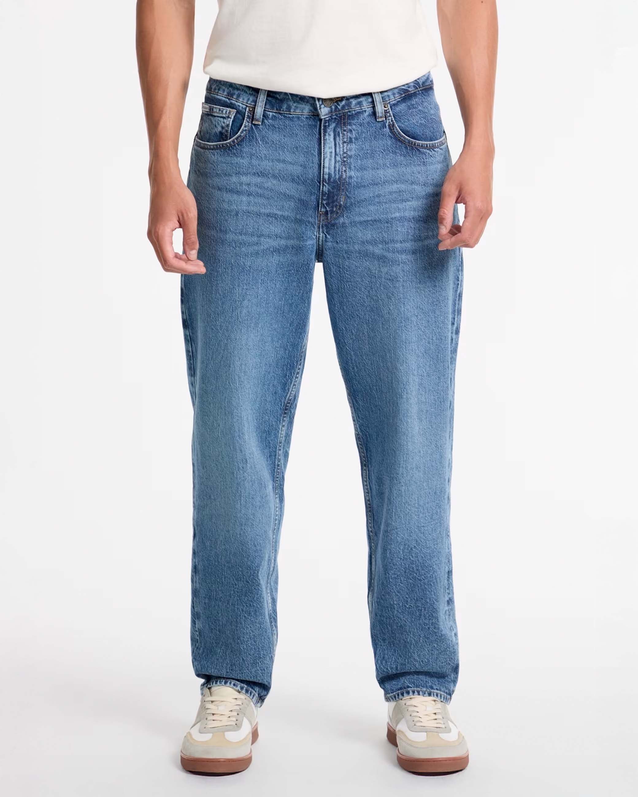 Jeans relaxed fit lavaggio medio stone washed in cotone stretch