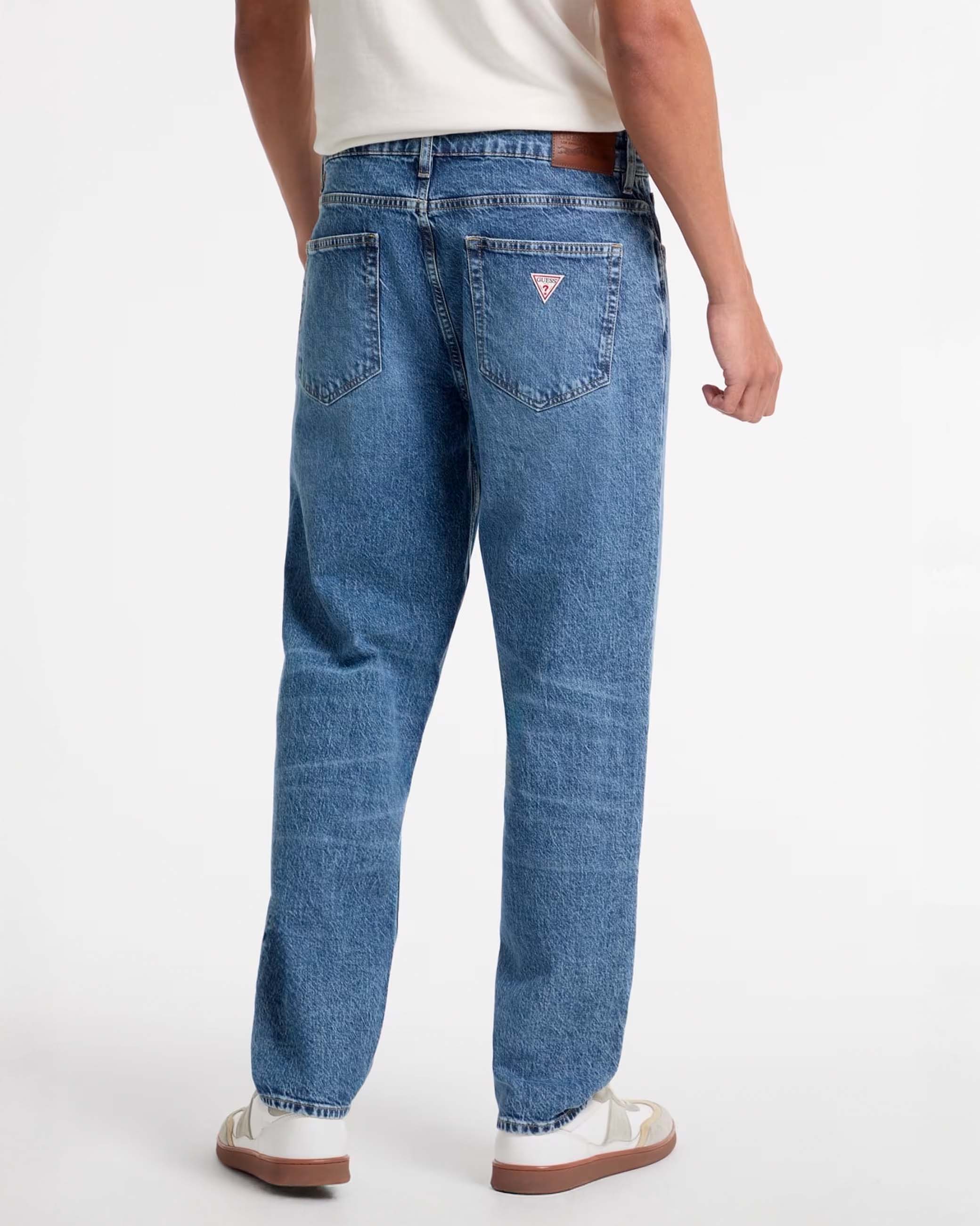 Jeans relaxed fit lavaggio medio stone washed in cotone stretch