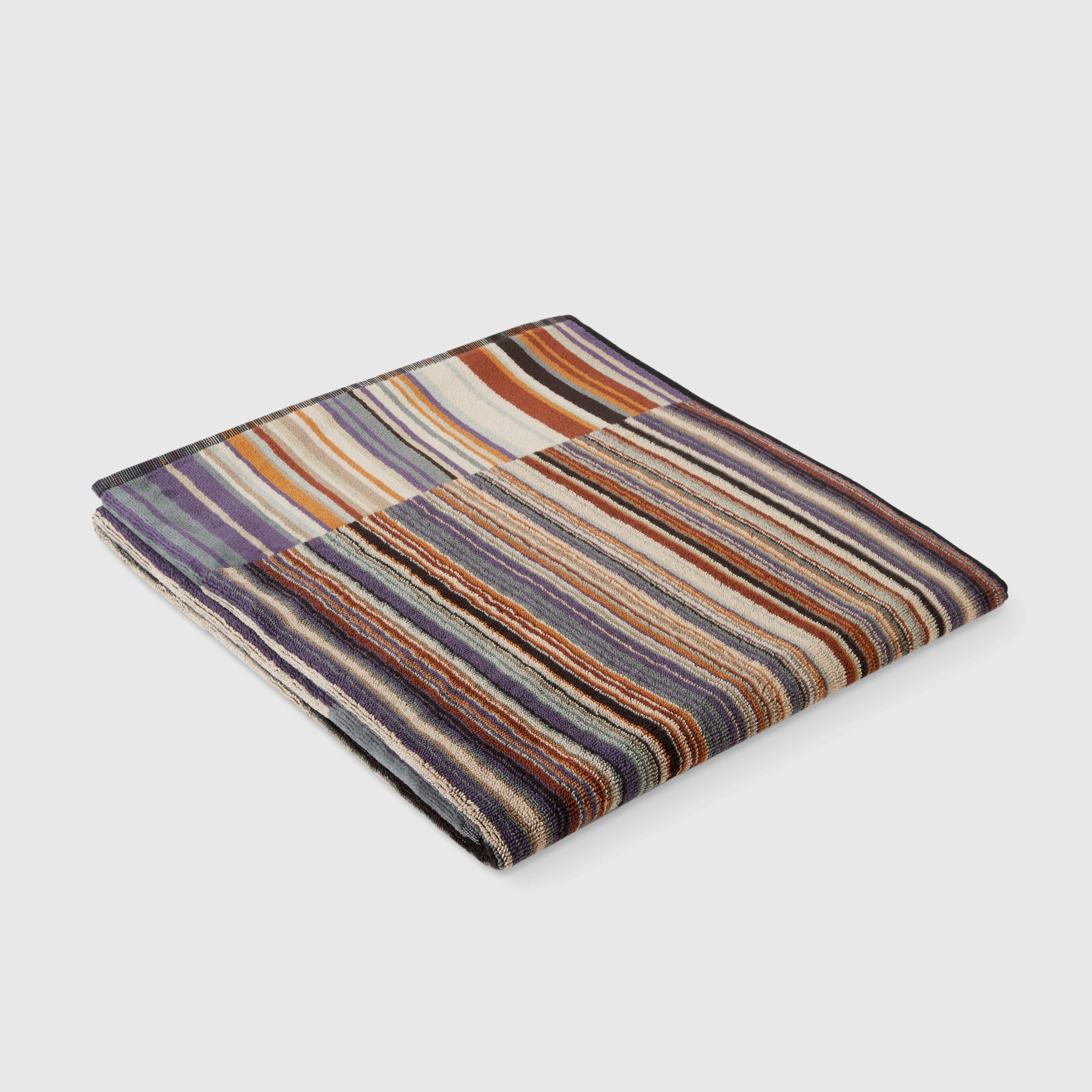 Asciugamano Jazz in spugna di cotone a fantasia rigata nelle nuance del bruciato