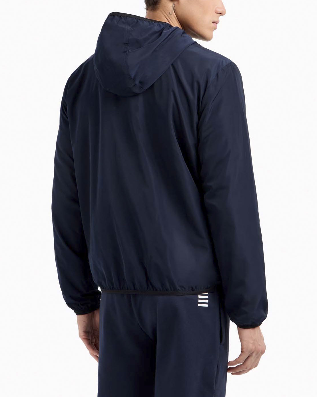 Giubbino EA7 blu in tessuto tecnico con cappuccio e logo stampato sul petto image