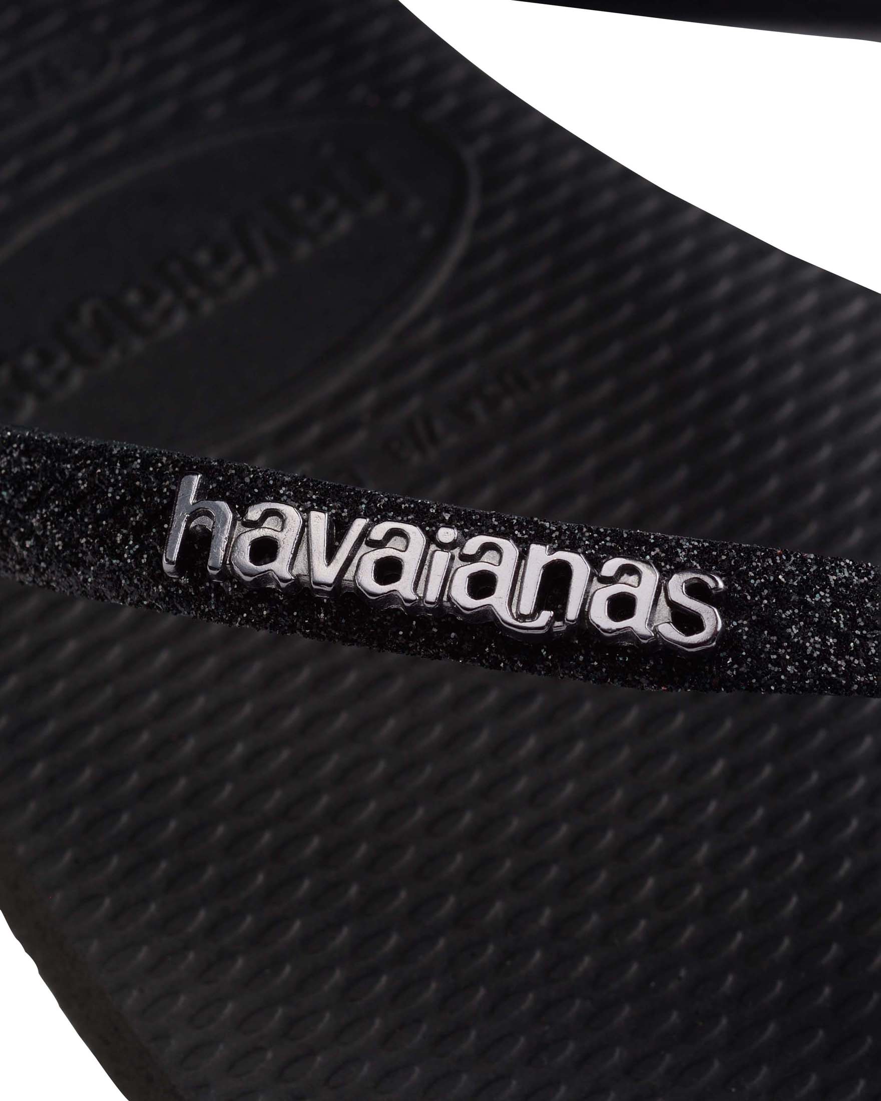 Havaianas Slim Glitter II neri con glitter sulle fascette e scritta logo a rilievo in metallo