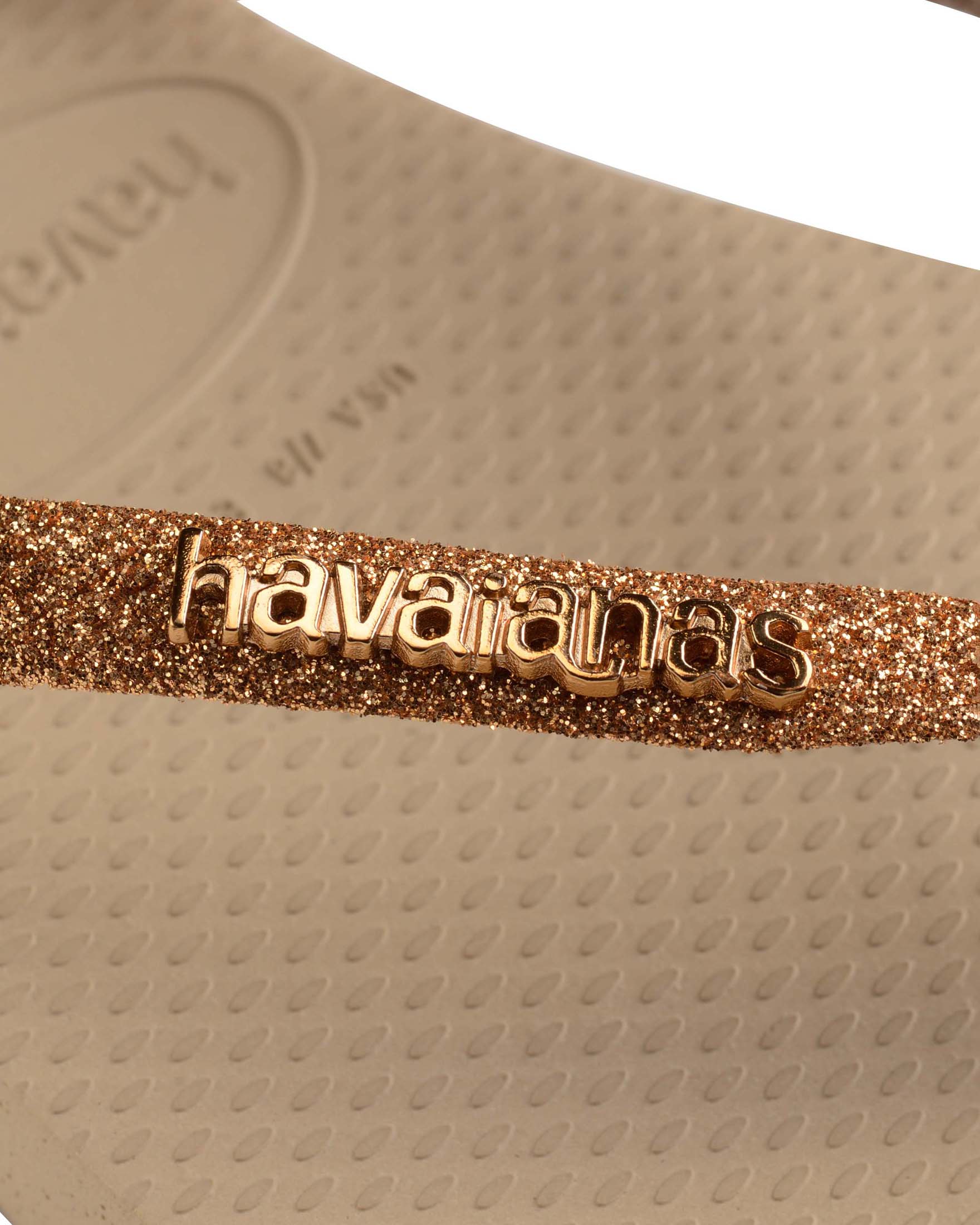 Havaianas Slim Glitter II color oro con glitter sulle fascette e scritta logo a rilievo in metallo image