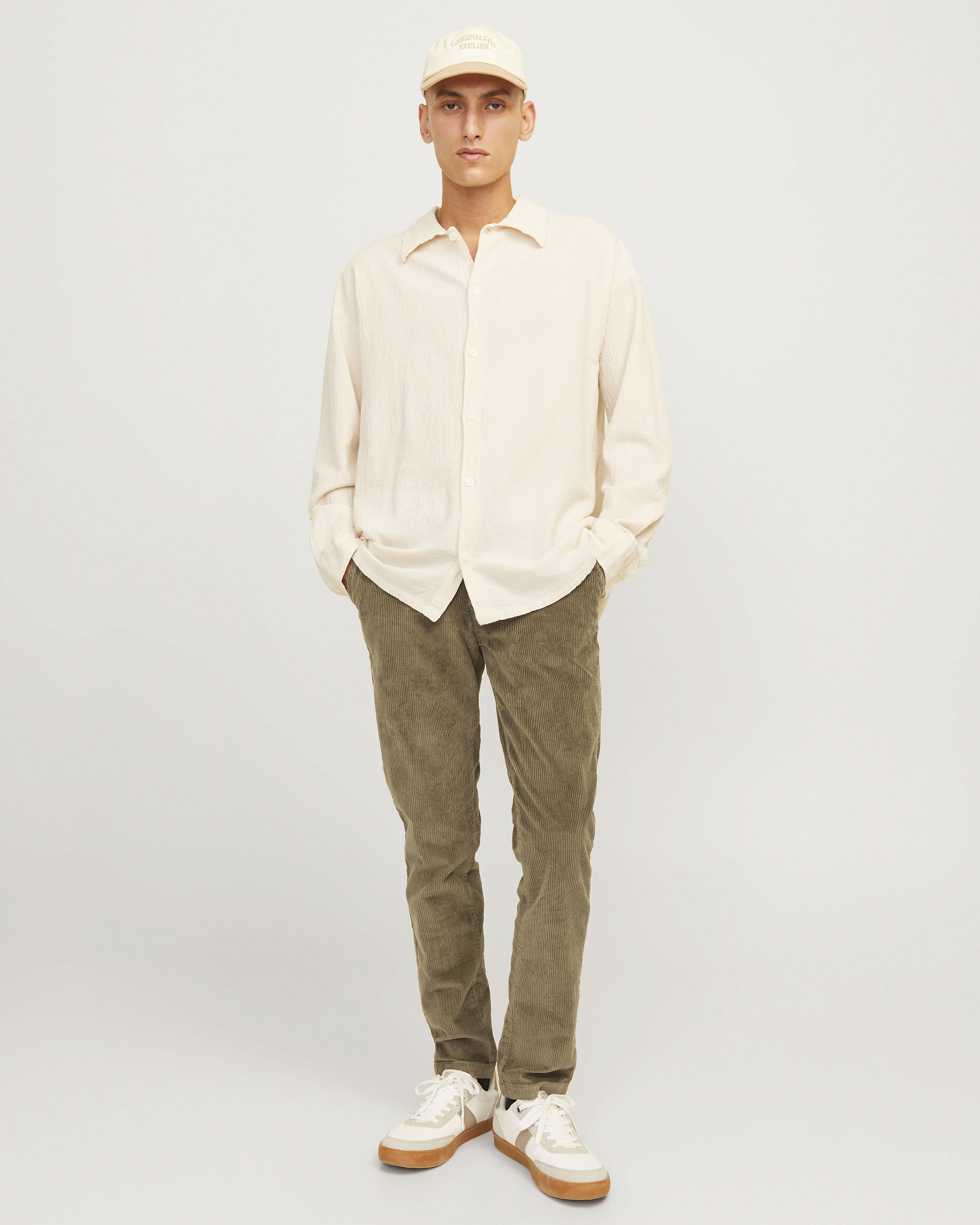 Pantaloni chino slim-fit color fango in velluto a coste di cotone stretch a vita media