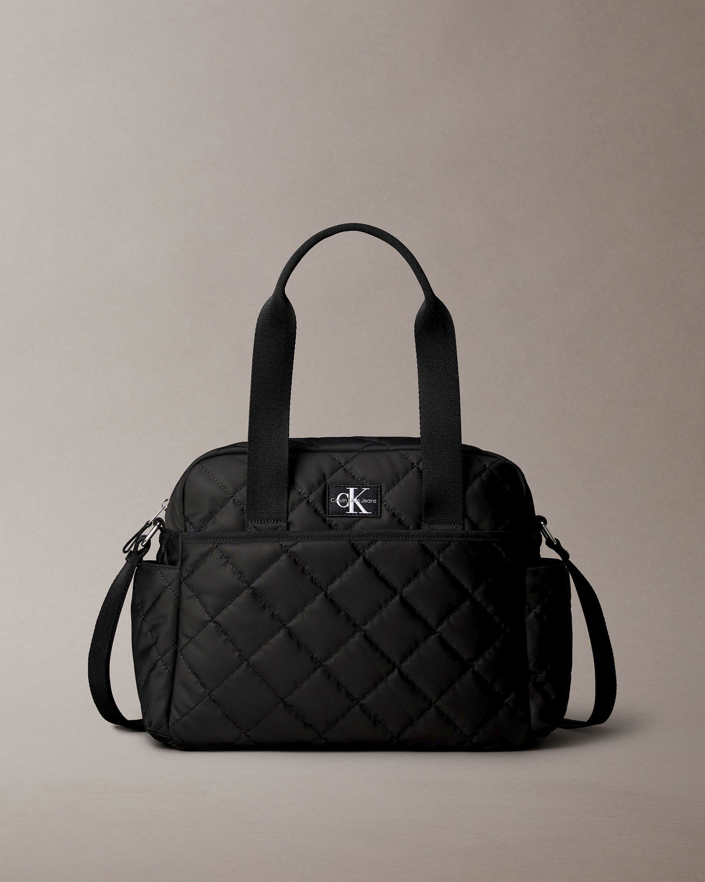 Borsa Calvin Klein nera in tessuto trapuntato con tracolla e fasciatoio portatile