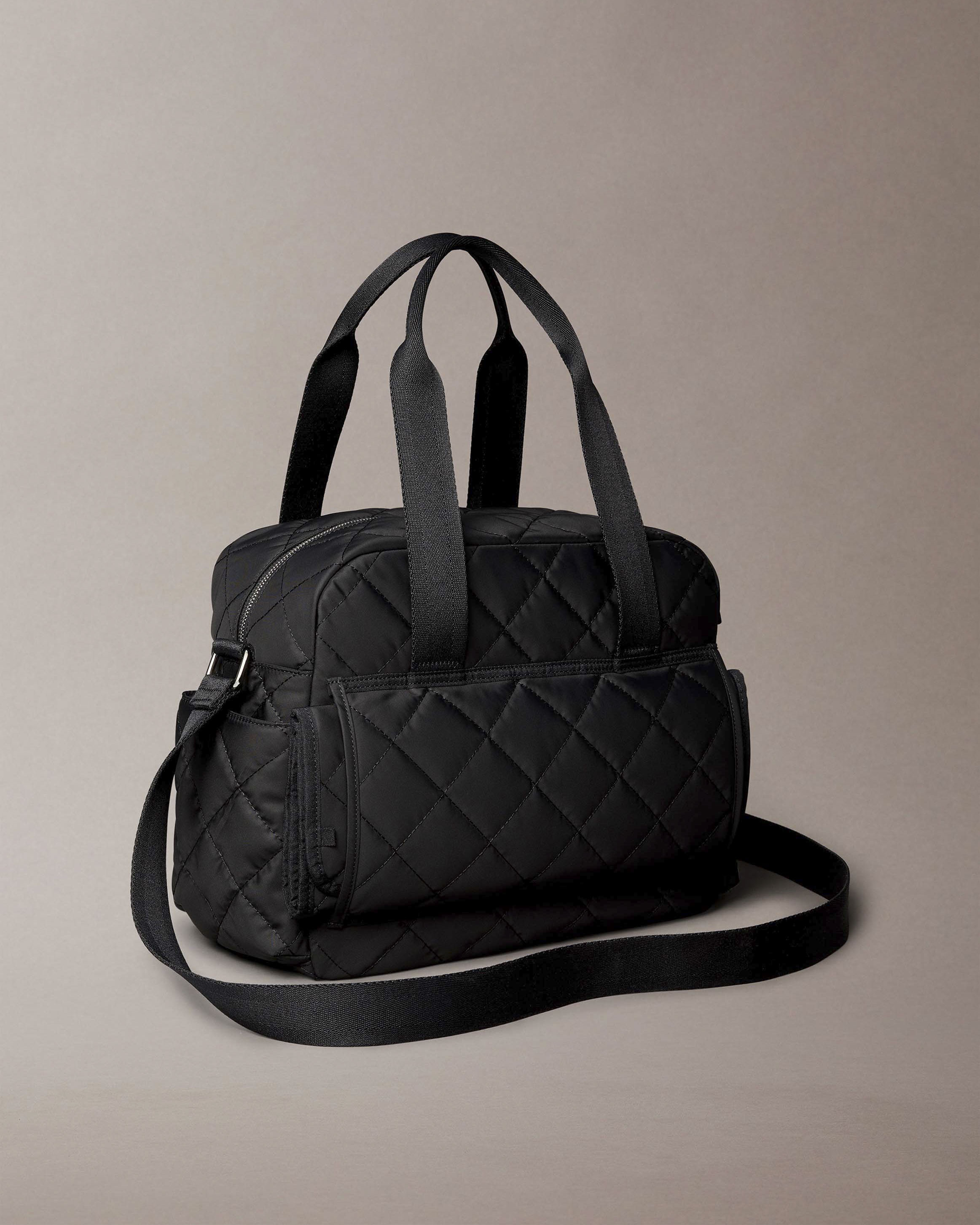 Borsa Calvin Klein nera in tessuto trapuntato con tracolla e fasciatoio portatile image