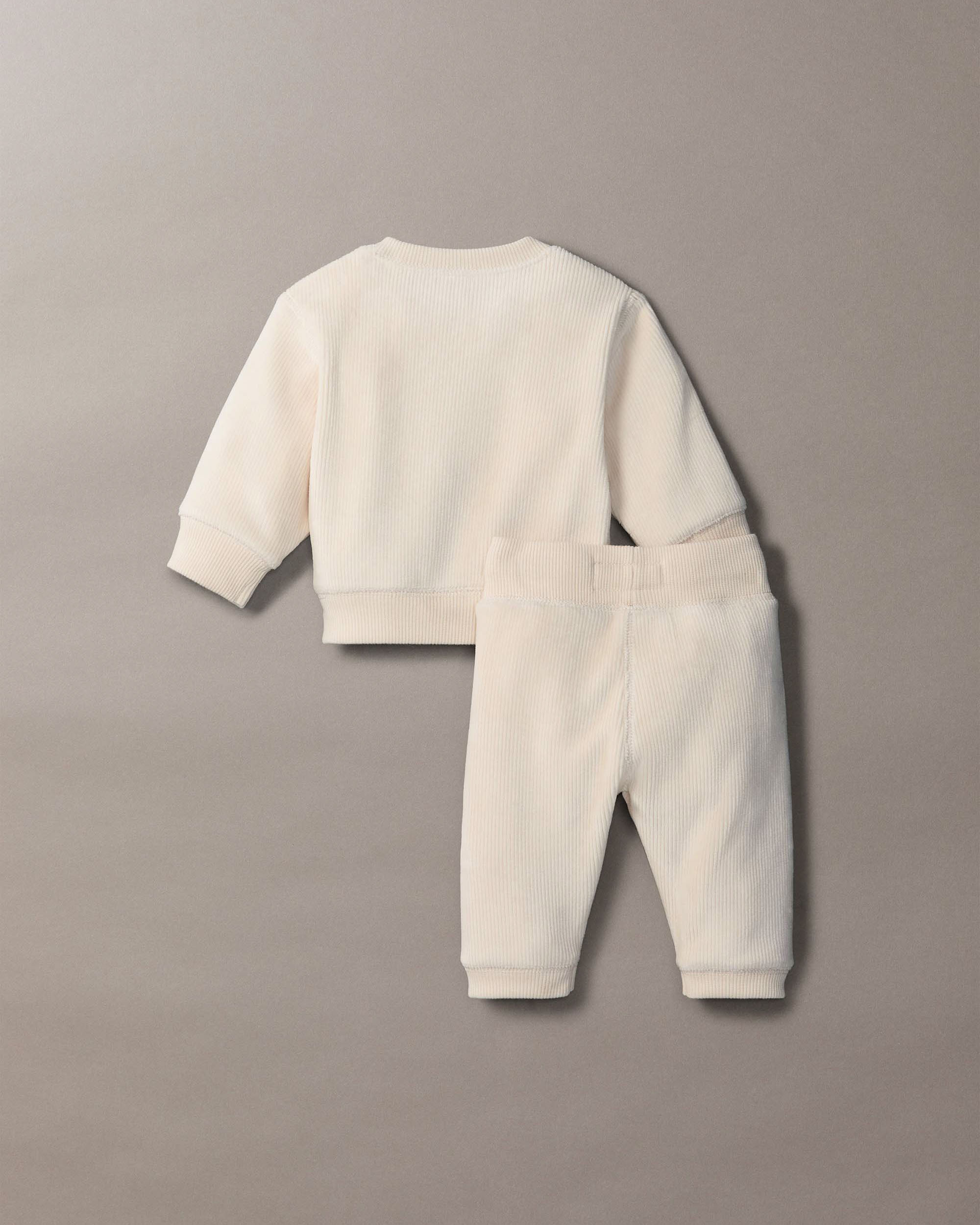 Completo Calvin Klein maglia e pantalone color panna a costine in ciniglia image