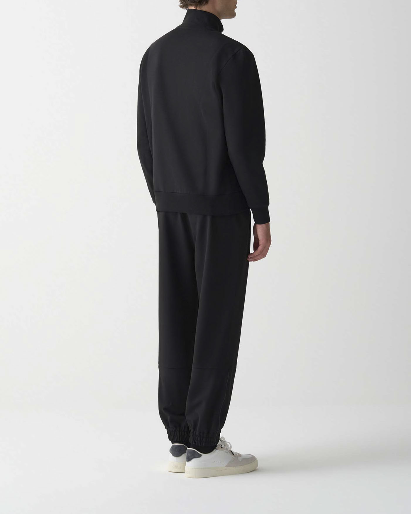 Felpa Colmar Originals nera con chiusura zip e logo bollo applicato sulla manica