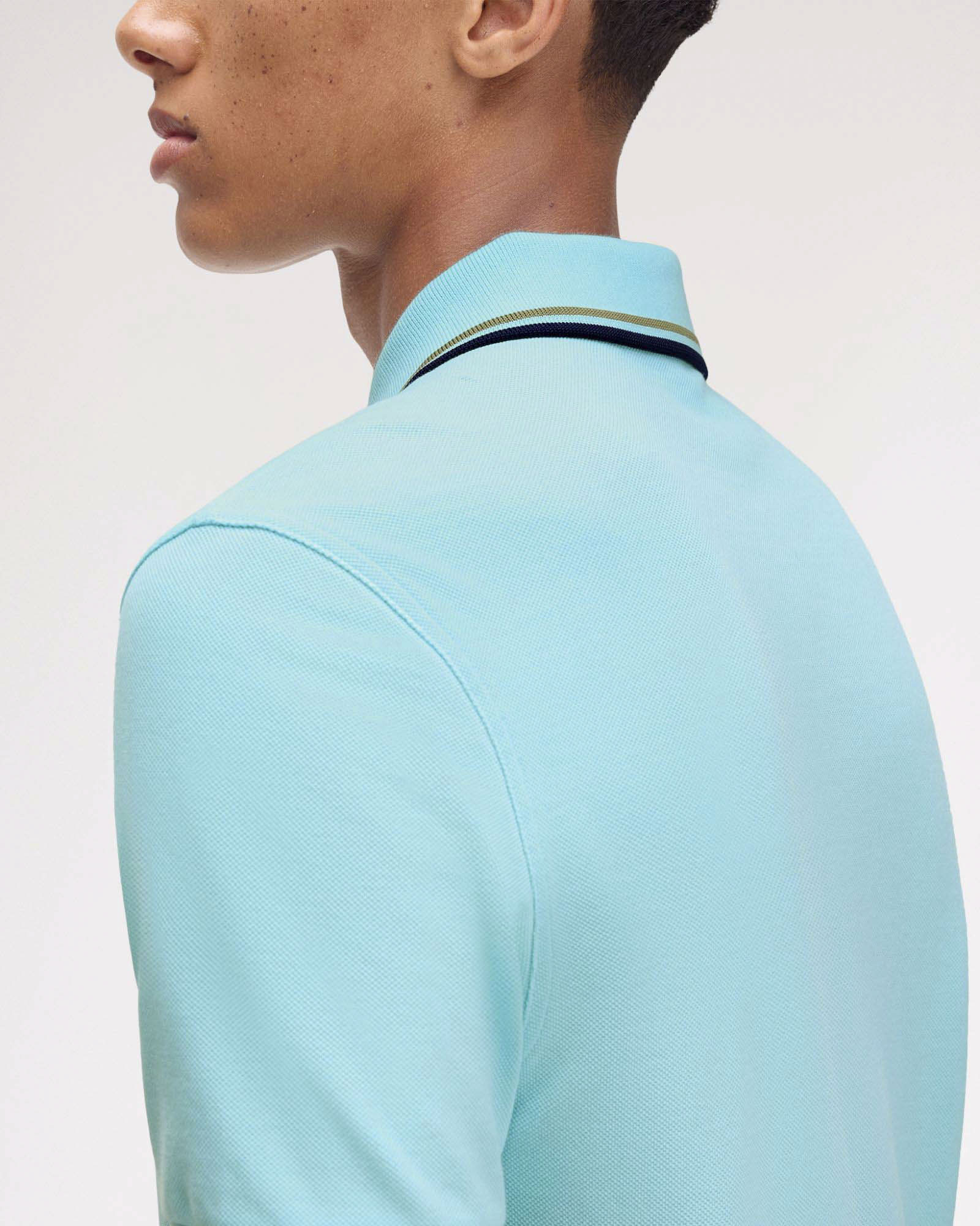 Polo Fred Perry color acqua mezza manica con bordino blu e militare