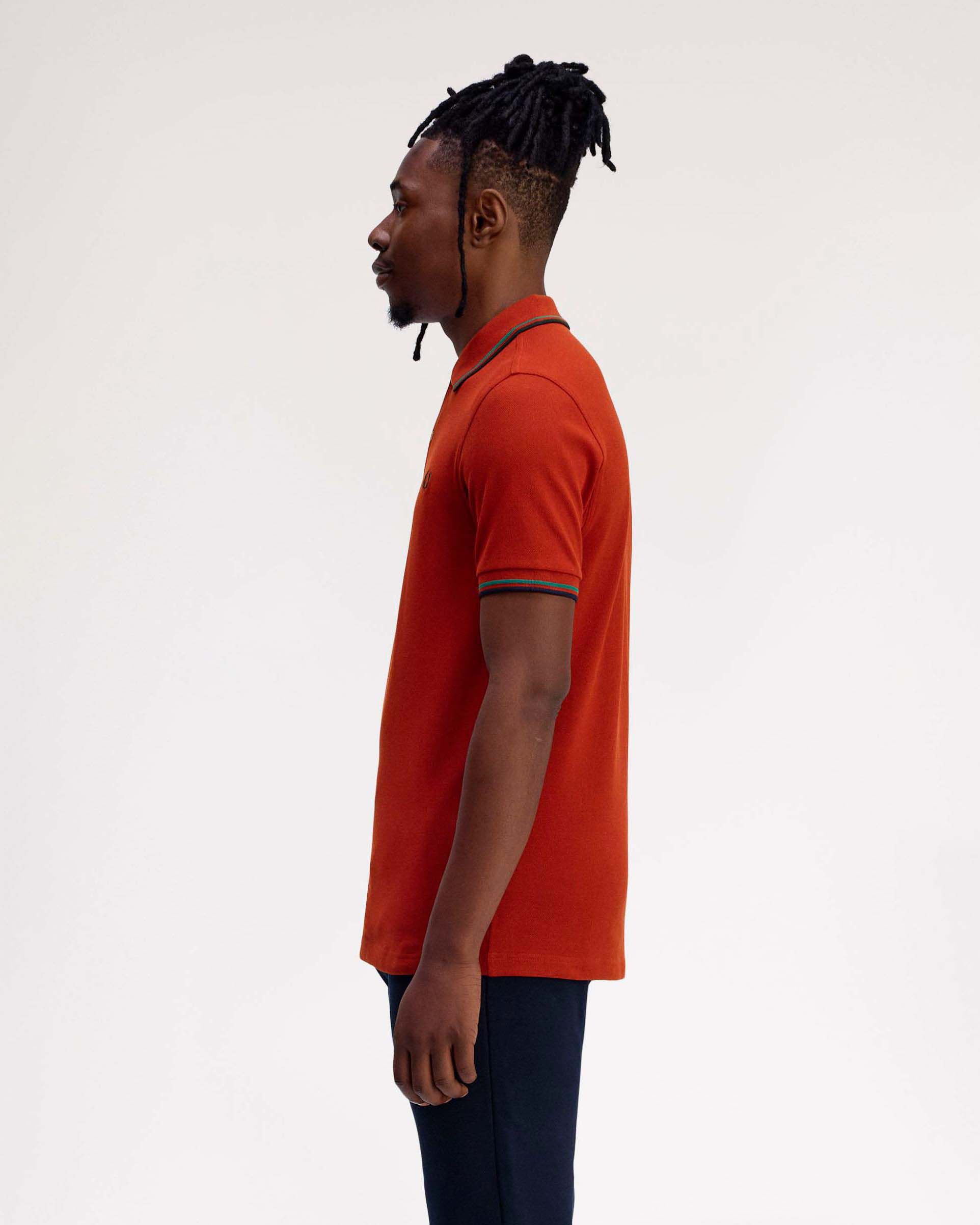 Polo Fred Perry arancione mezza manica con bordino verde acqua e blu