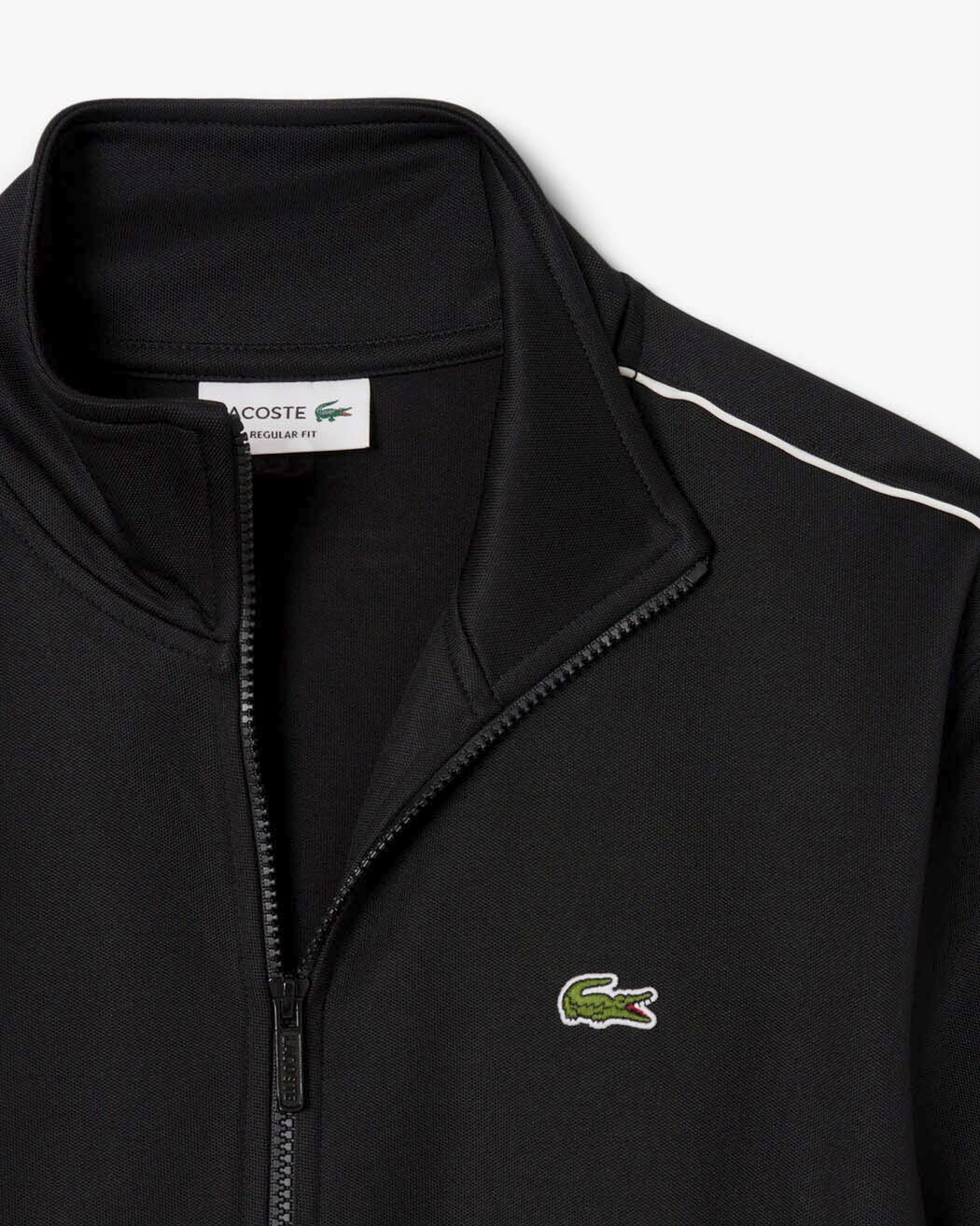 Felpa Lacoste nera in piquè interlock con piping bianco e chiusura zip image