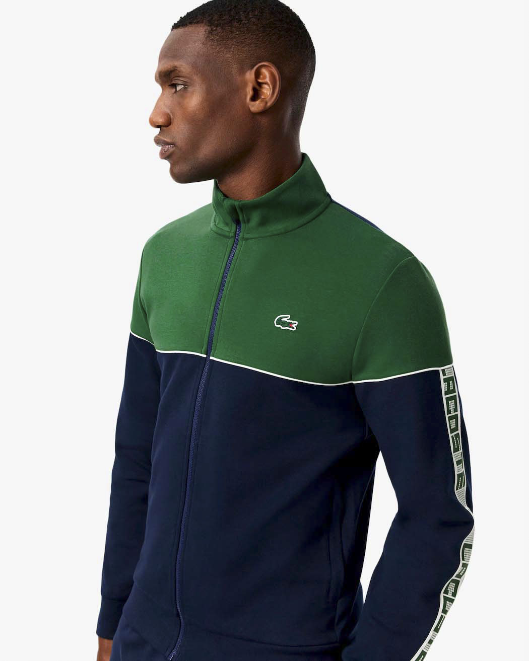 Felpa Lacoste color block verde e blu con piping porta logo e chiusura zip image