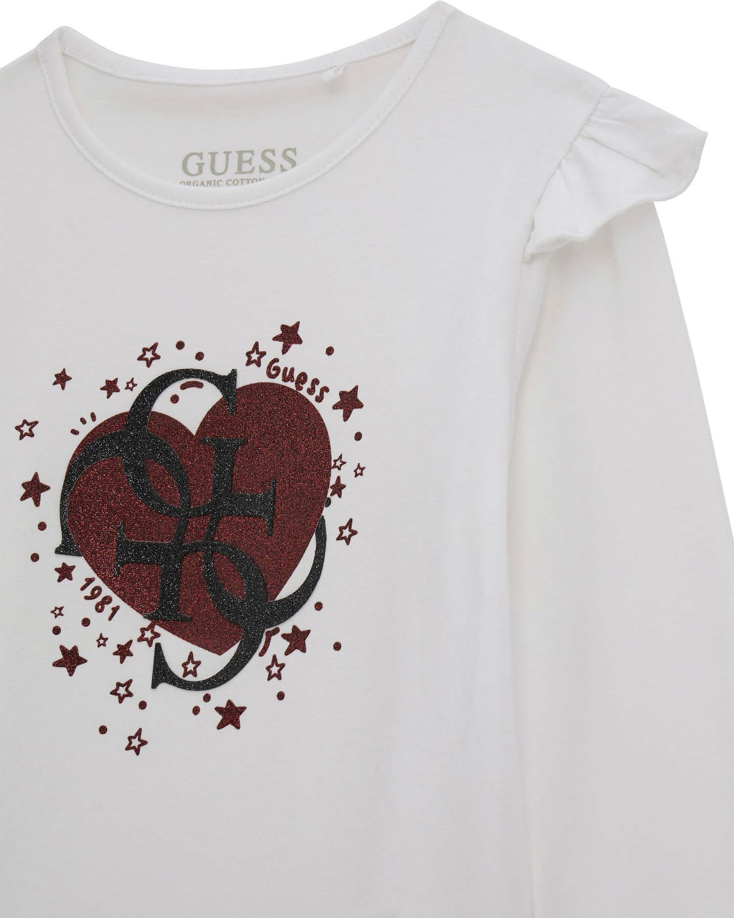 T-shirt Guess bianca con volant e logo monogram con cuore brillantinato image