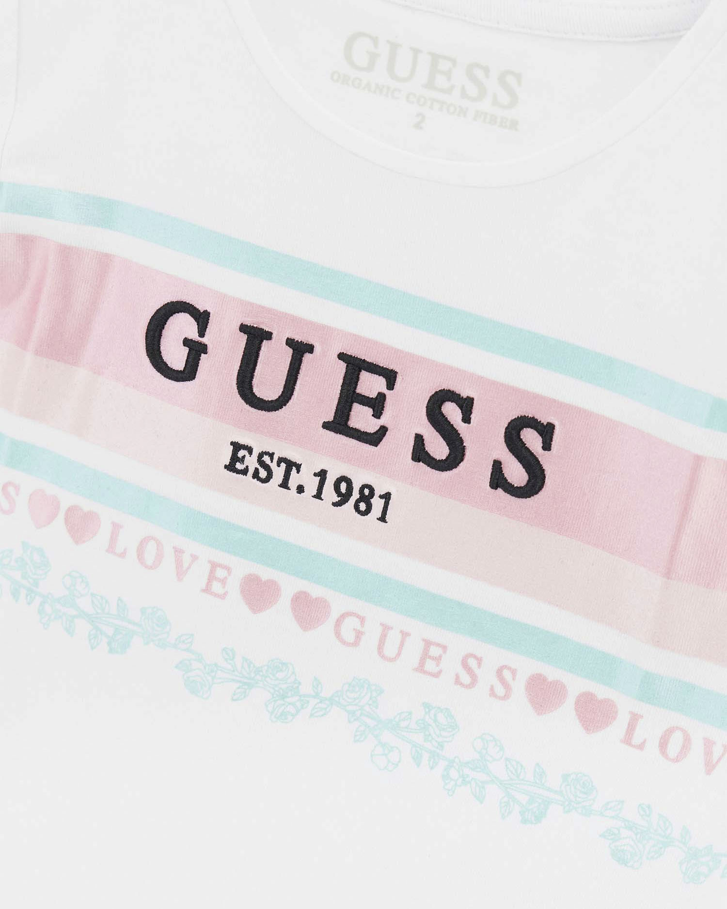 T-shirt Guess bianca in cotone stretch con con bande rosa e azzurre image