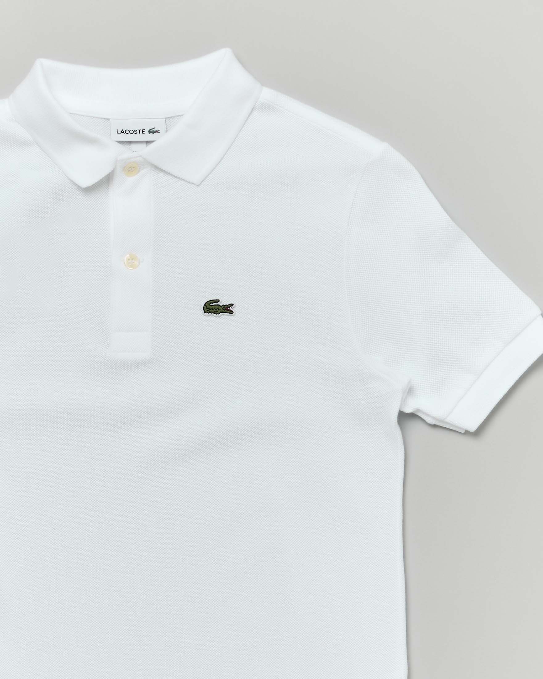 Polo Lacoste bianca piqué di puro cotone image