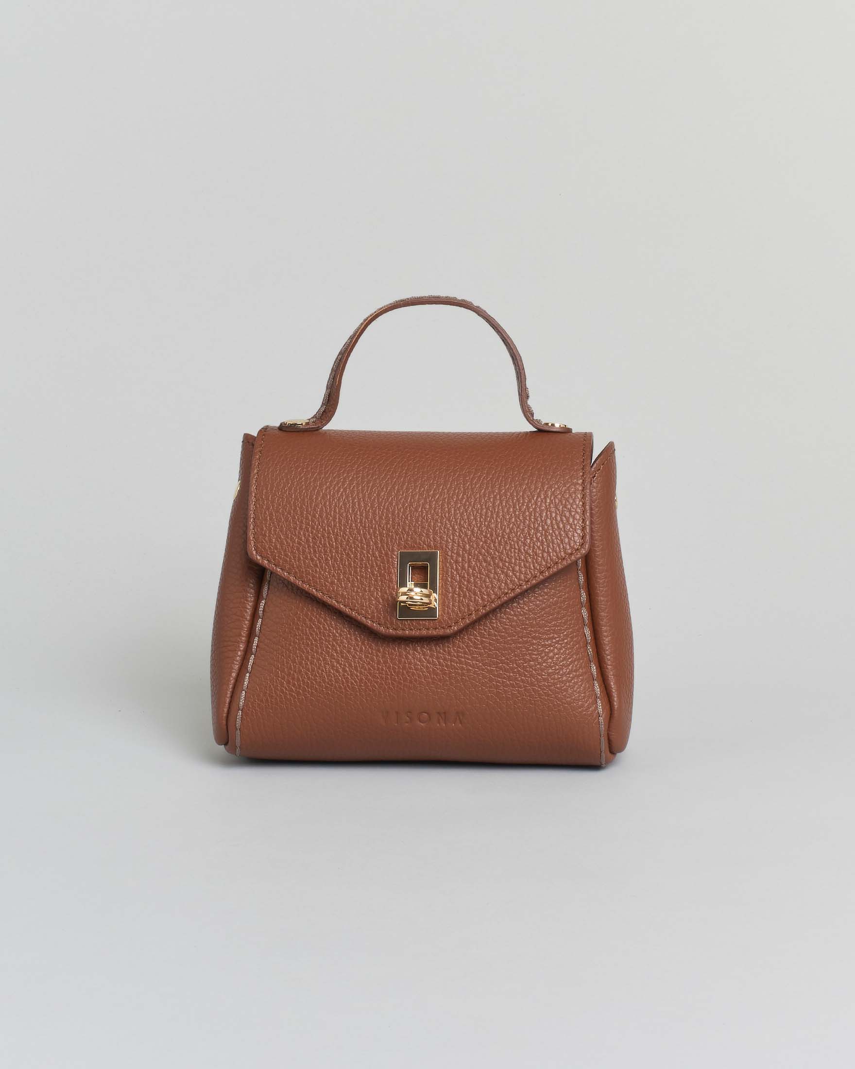 Mini bag Visonà color cuoio in pelle martellata con impunture e patta di chiusura