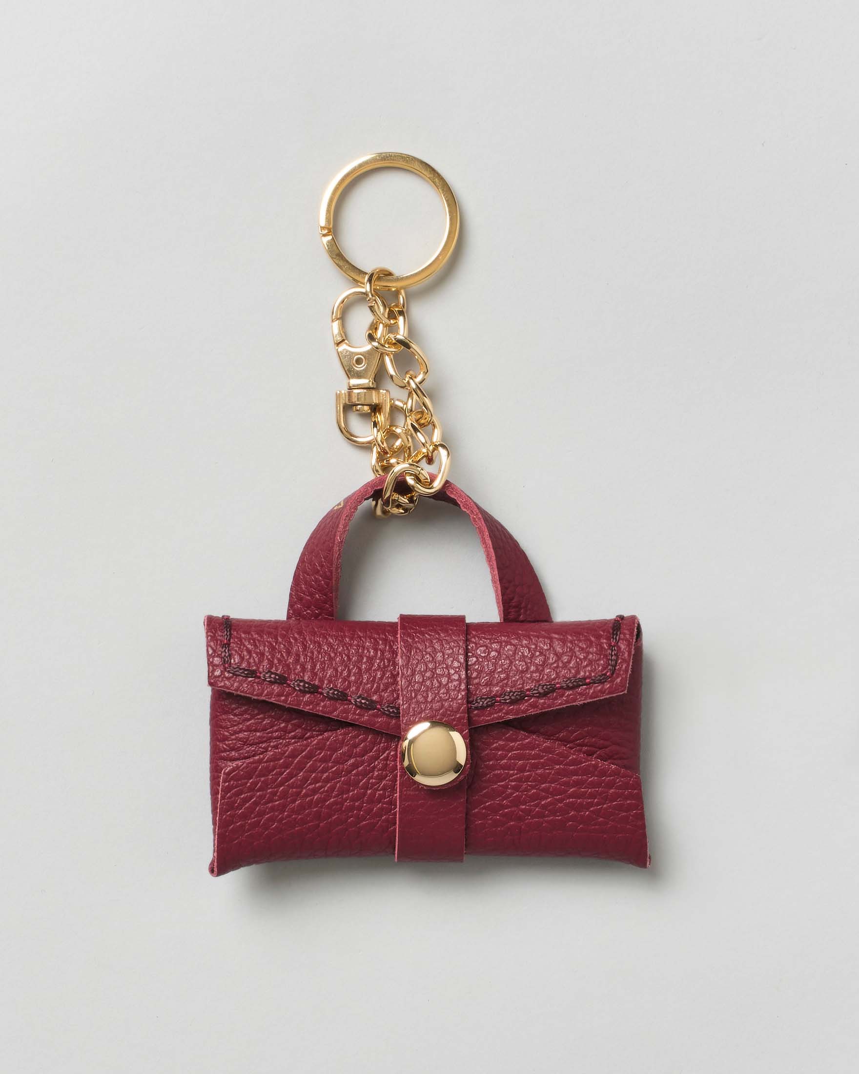 Portachiavi Visonà a borsina in pelle martellata rossa con catena e anello dorati