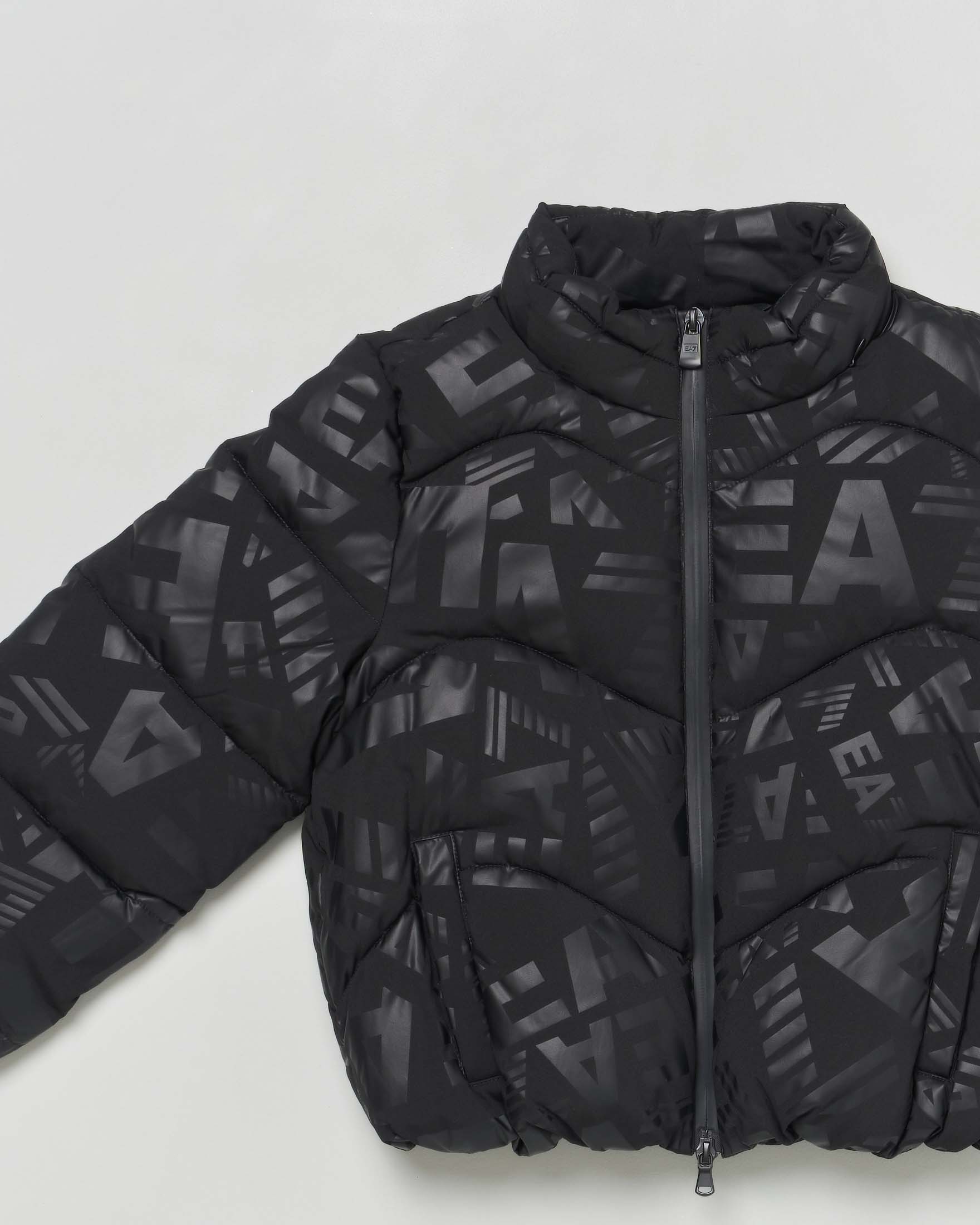Piumino EA7 nero opaco con loghi monogram lucidi all over image