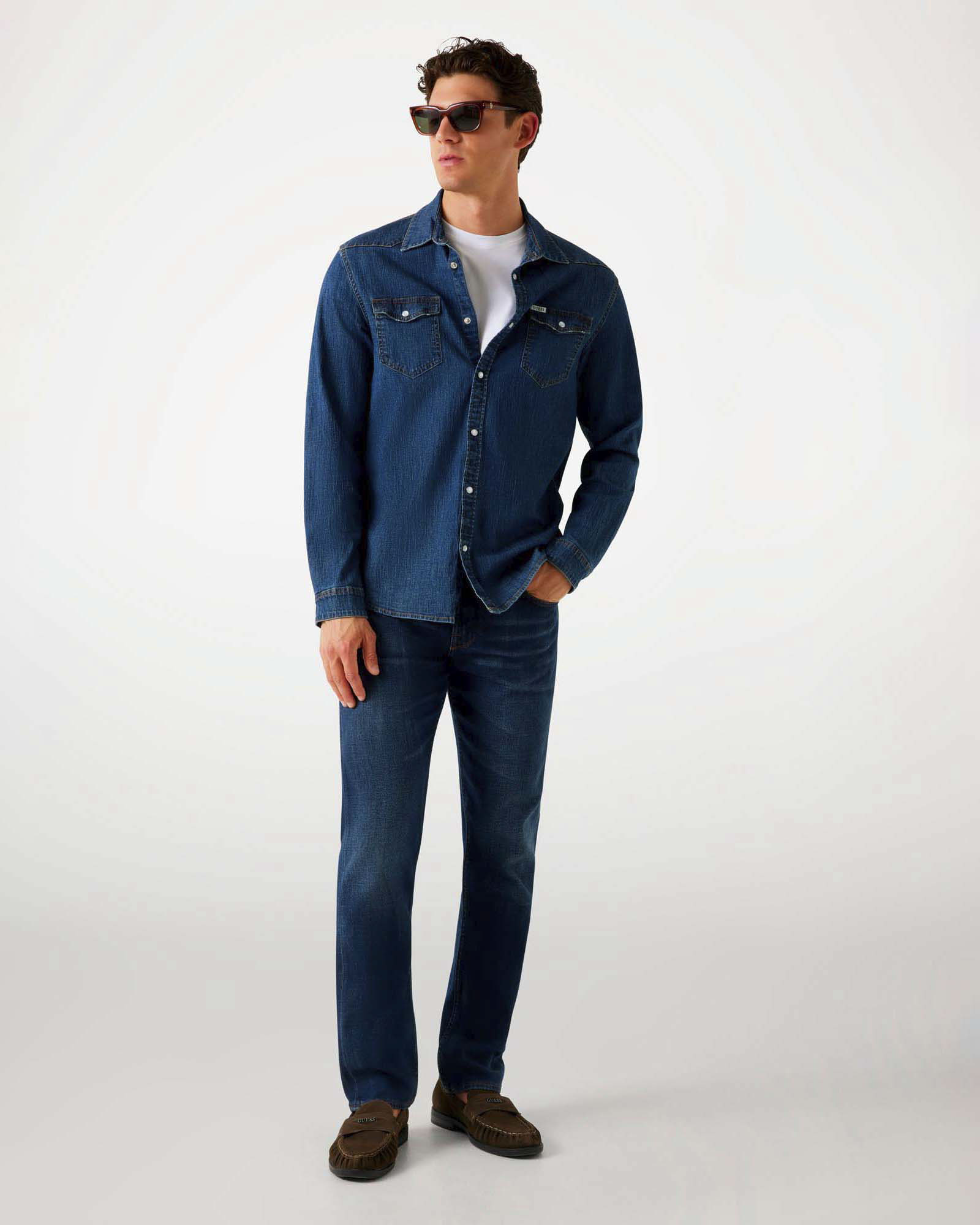 Jeans slim Guess blu in cotone elasticizzato lavaggio scuro stone washed