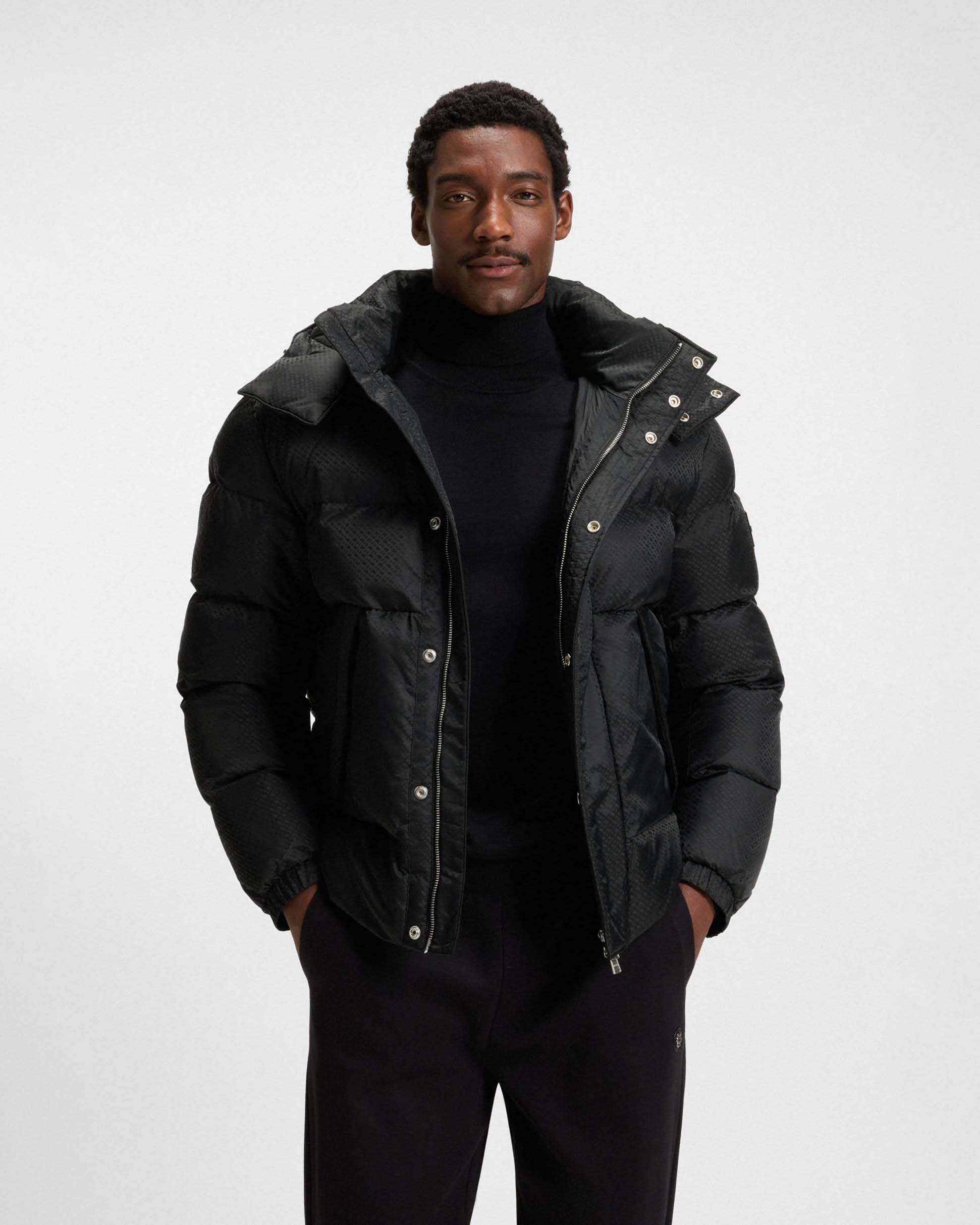 Piumino Boss nero in nylon idrorepellente con motivo monogramma in rilievo e cappuccio staccabile image