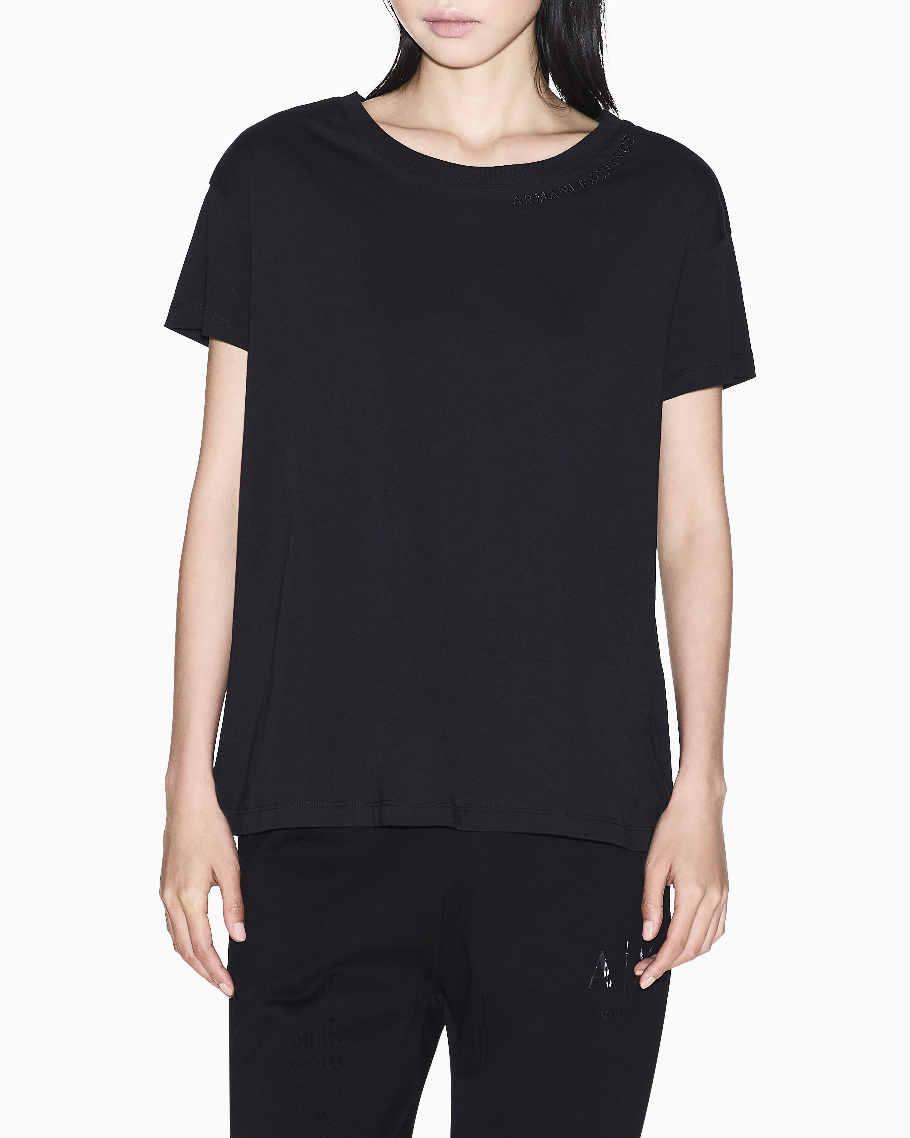 T-shirt Exchange nera in cotone con logo in rilievo sullo scollo