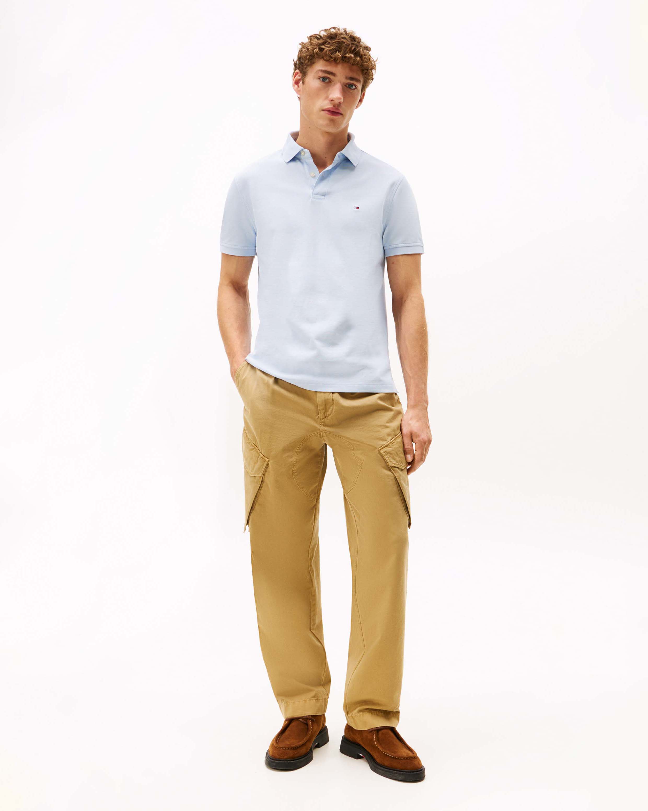 Polo mezza manica Tommy Hilfiger azzurra in cotone stretch con logo flag ricamato sul petto