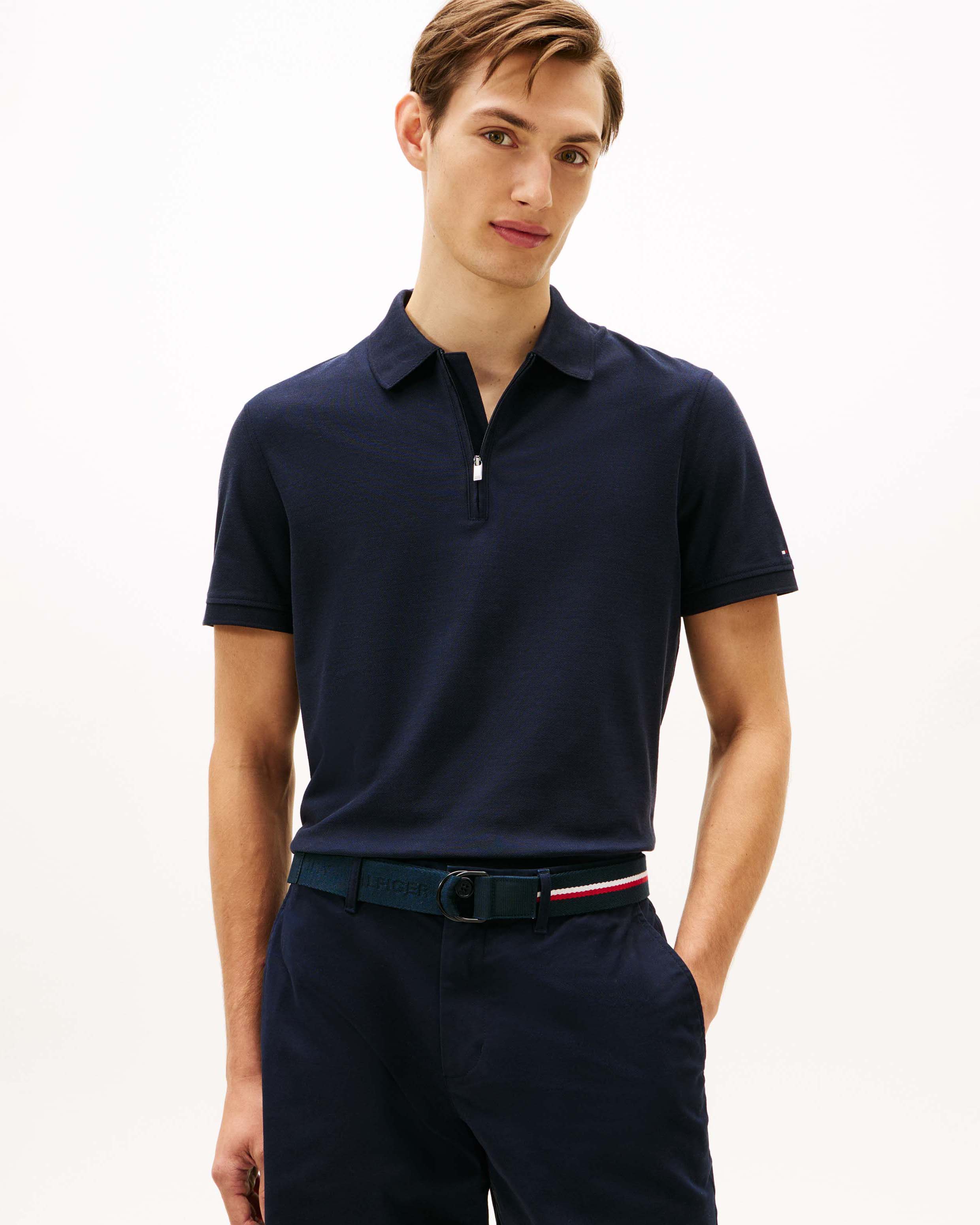 Polo Tommy Hilfiger blu in cotone con apertura zip e piccolo logo flag ricamato sulla manica