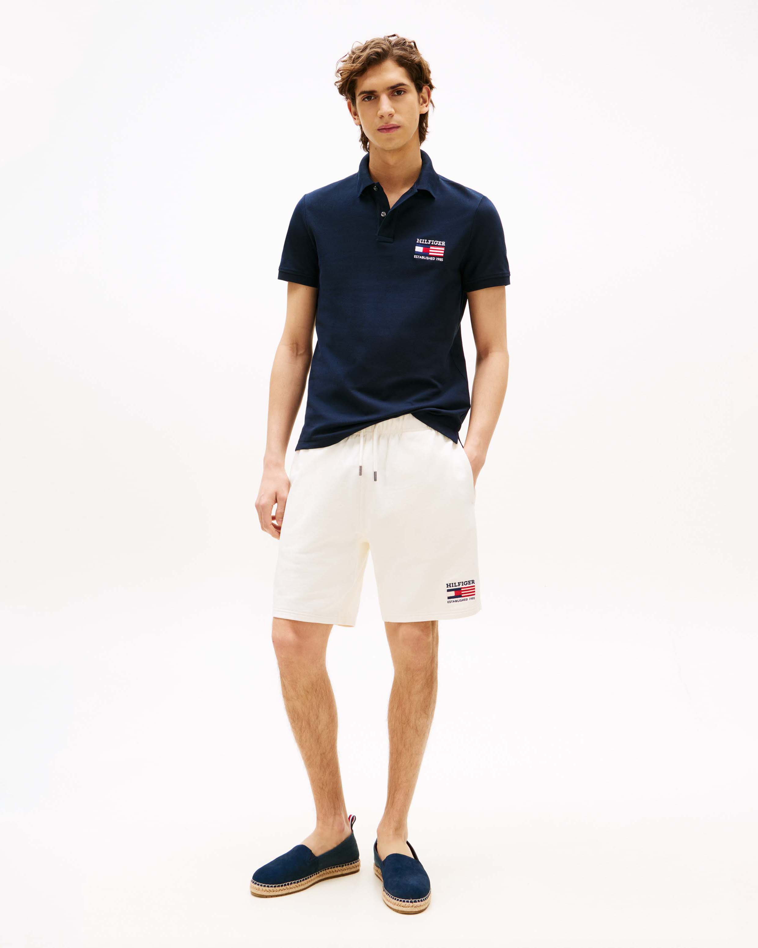 Polo Tommy Hilfiger blu in cotone stretch con logo flag ricamato sul petto