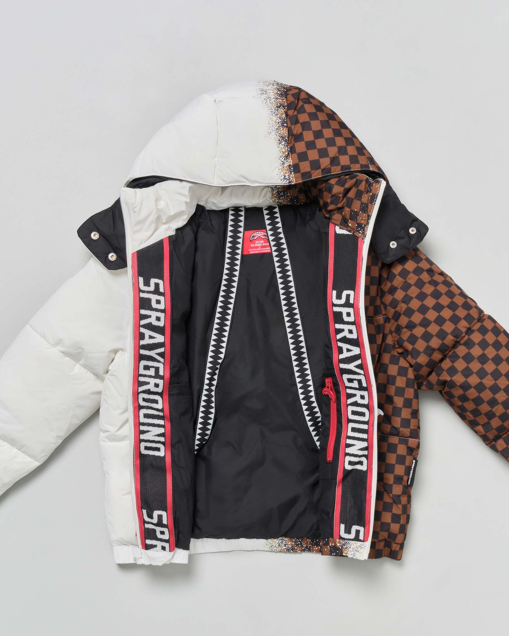Piumino Sprayground bianco e marrone checkered con cappuccio image