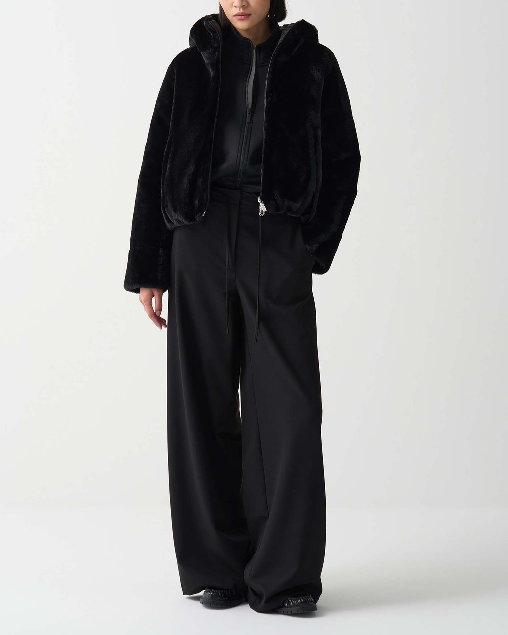 Ecopelliccia nera Colmar Originals reversibile nel tessuto trapuntato con cappuccio