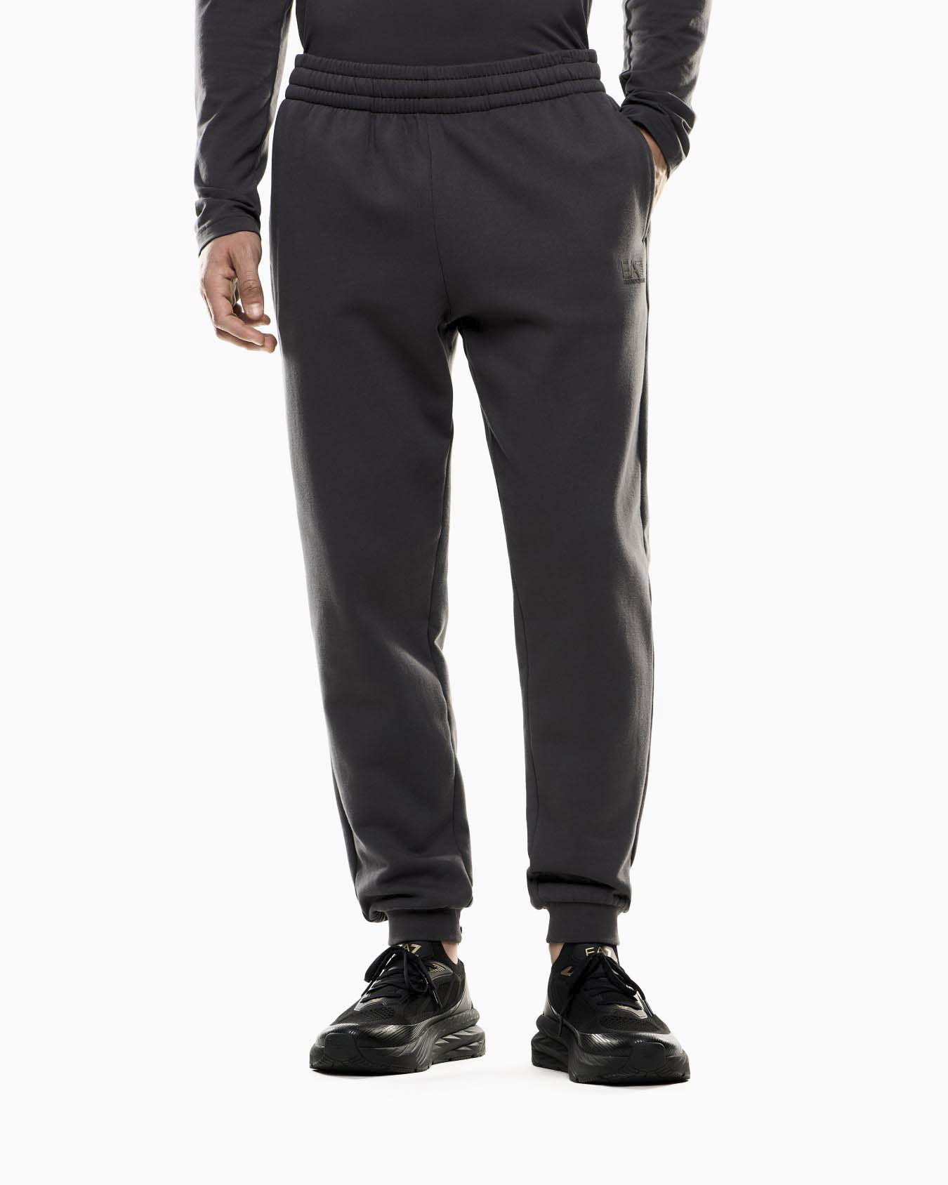 Pantaloni EA7 antracite in felpa di cotone con logo bianco gommato sul fianco destro