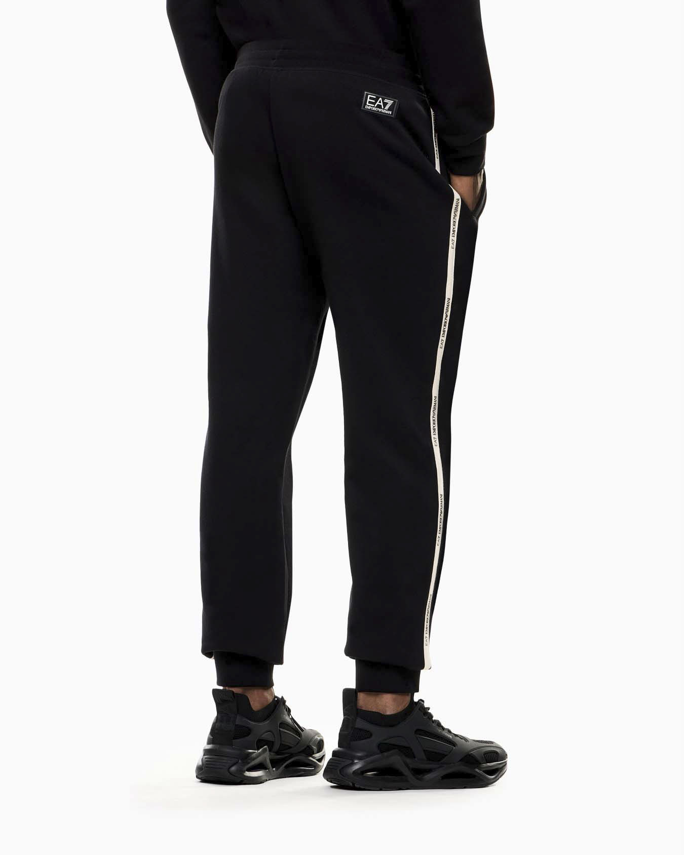 Pantaloni EA7 neri in misto cotone con banda laterale e logo stampato image
