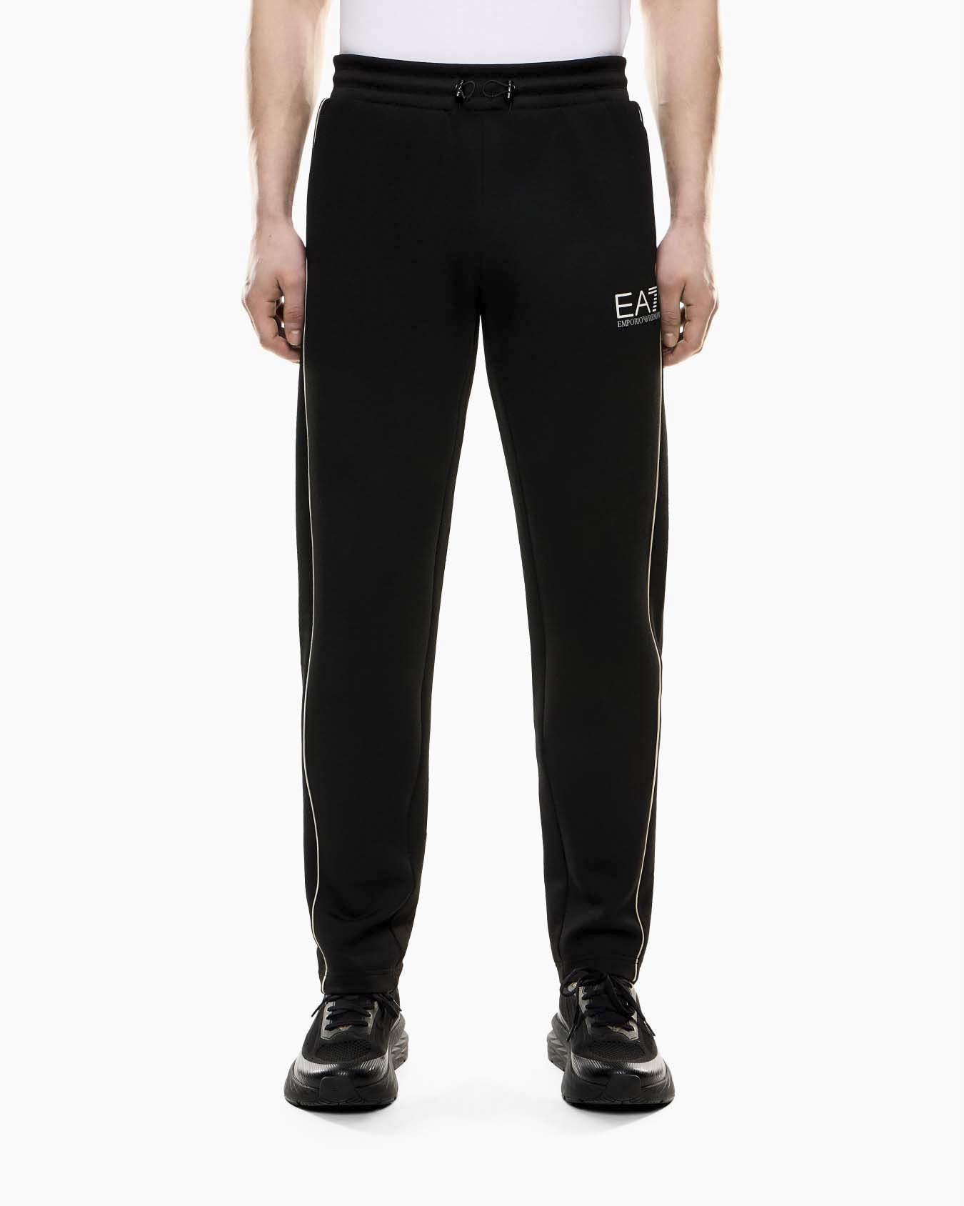 Pantaloni neri in misto viscosa con logo stampato e profili a contrasto