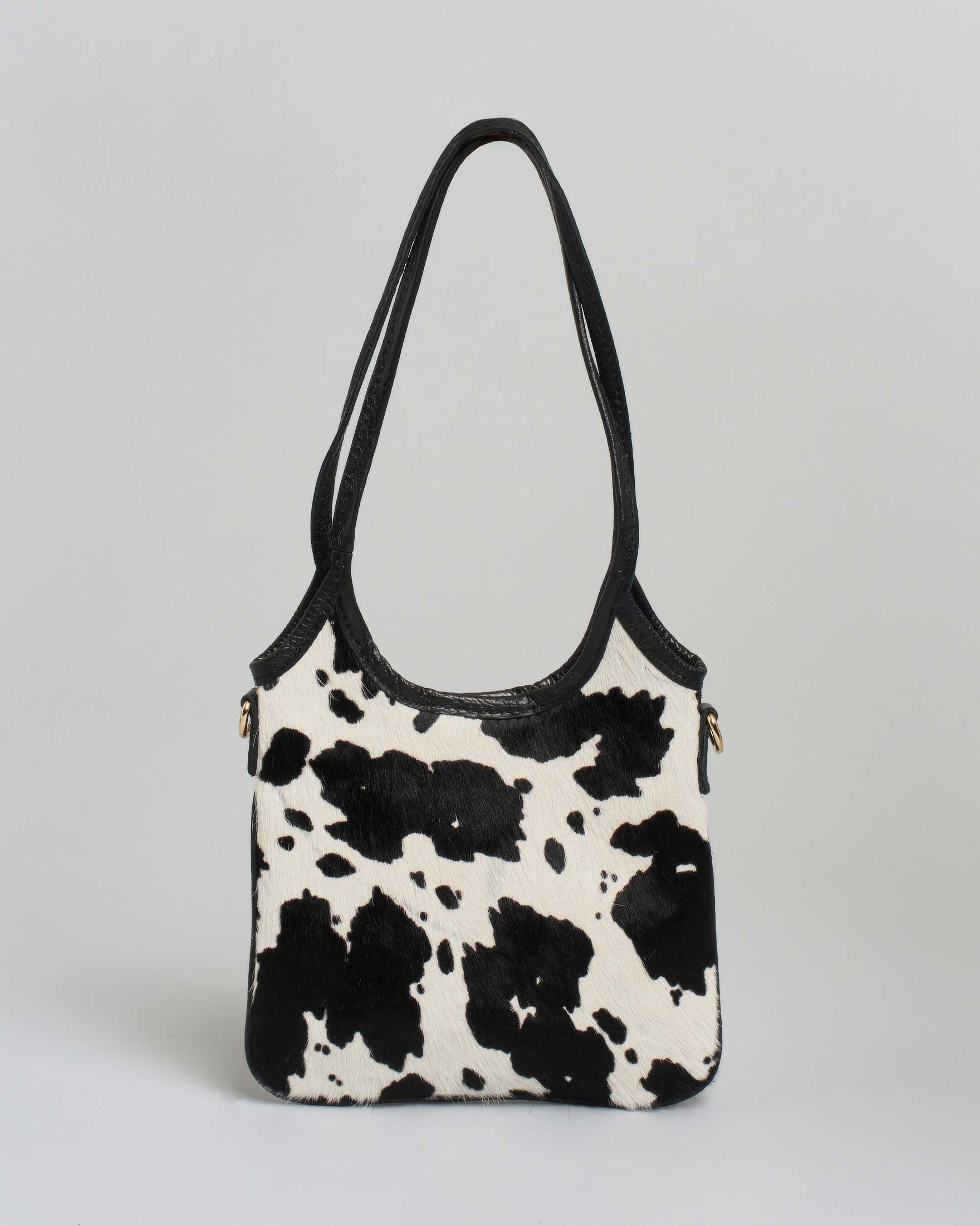 Mini tote bag nera in pelle martellata con parte frontale in cavallino zebrato