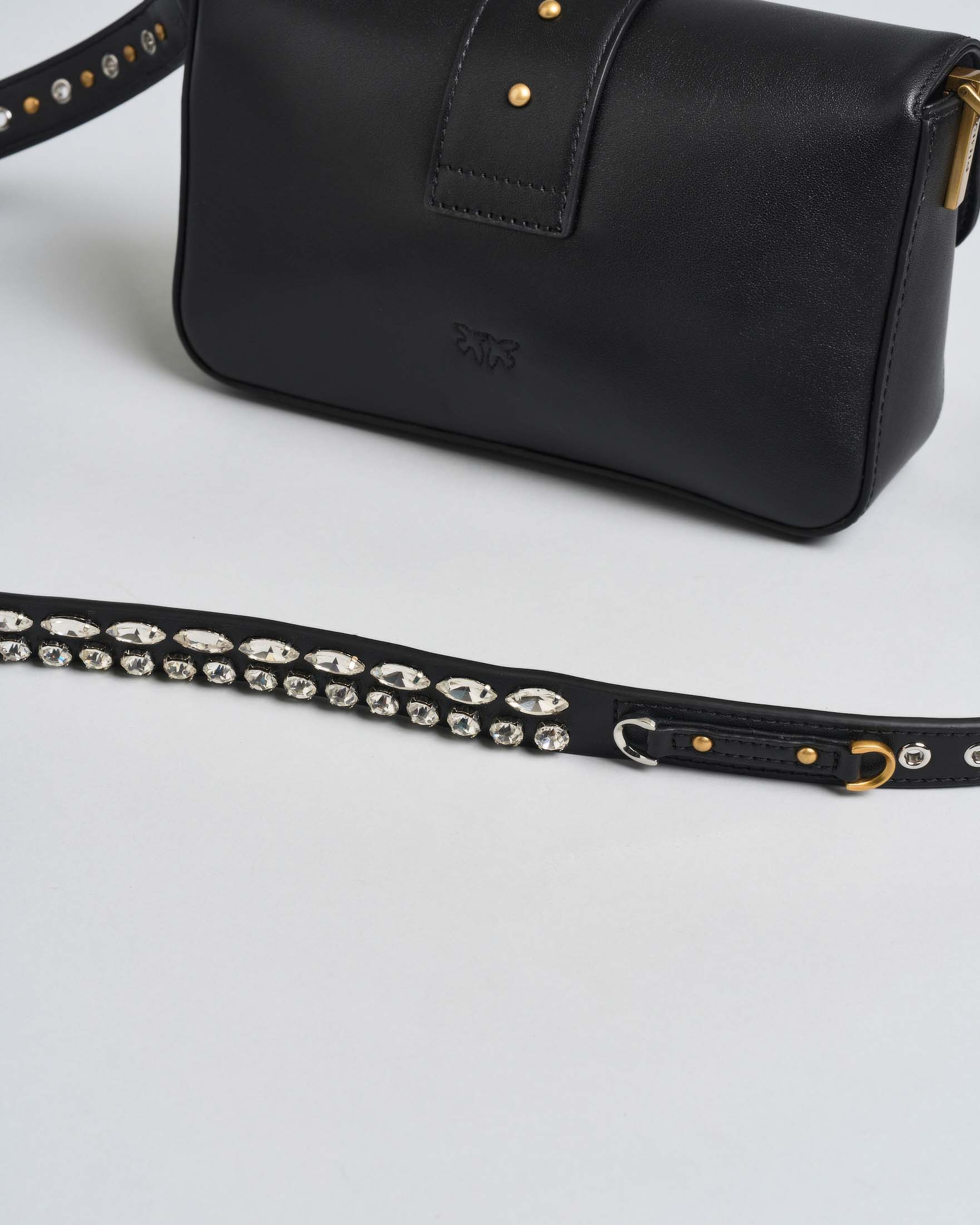 Borsa a spalla piccola nera Mini Love Bag Slouchy in pelle con borchie catene e strass applicati sulla tracolla image