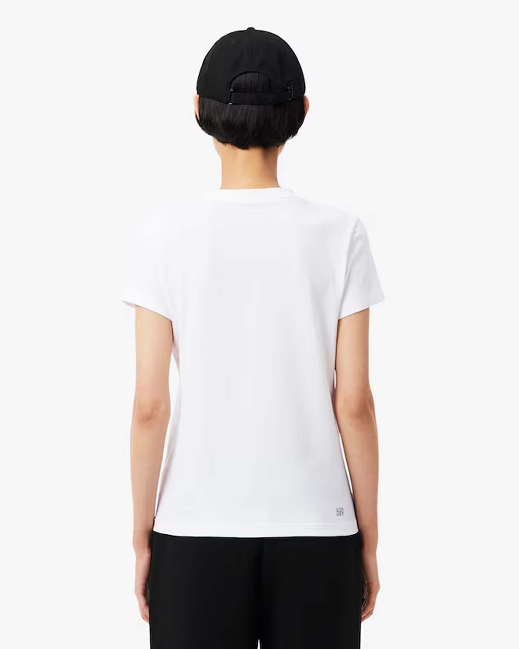 T-shirt bianca Lacoste in cotone stretch con scollo tondo e logo blu gommato cucito sul petto