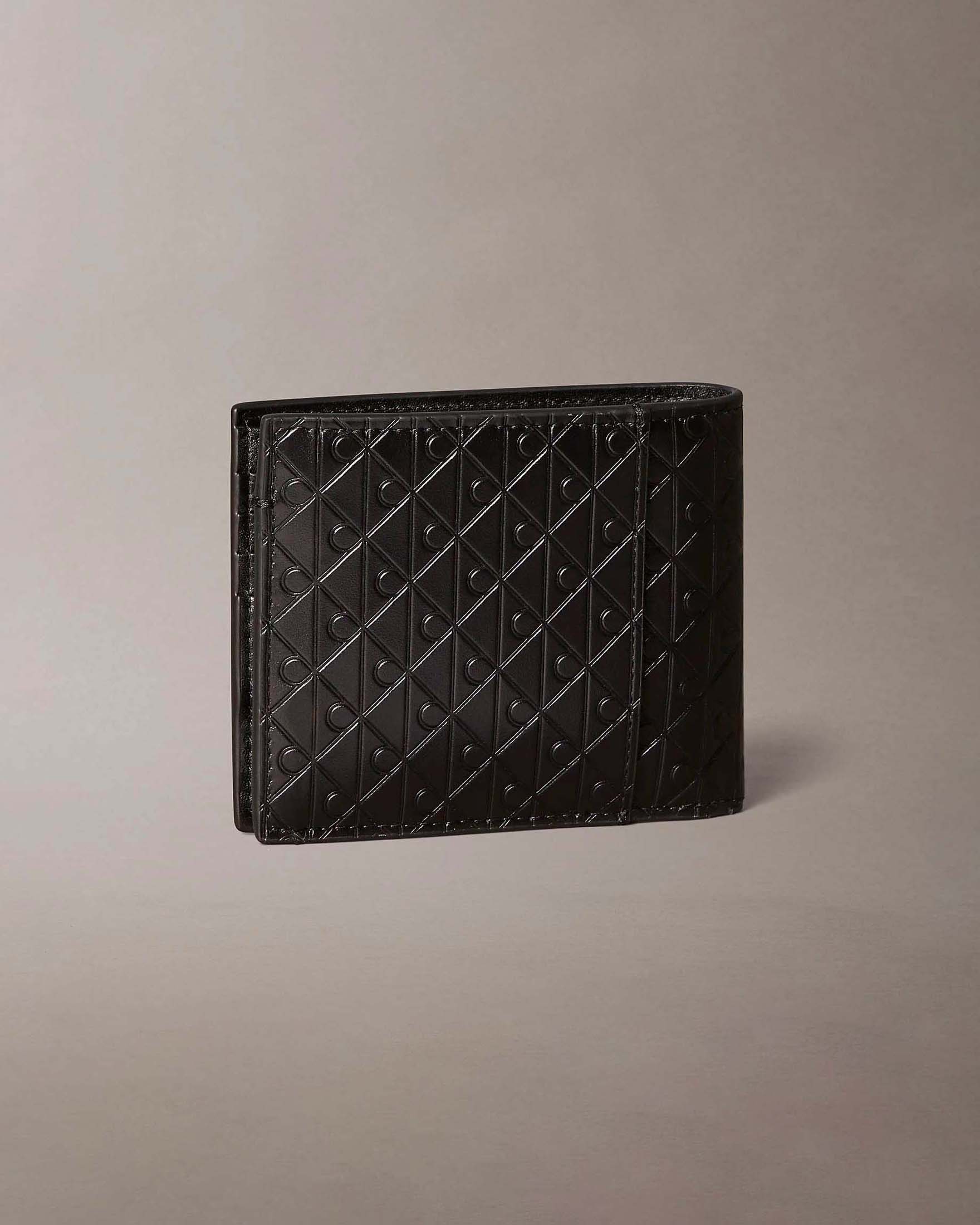 Portafoglio Calvin Klein Jeans nero in pelle con logo monogramma embossato allover