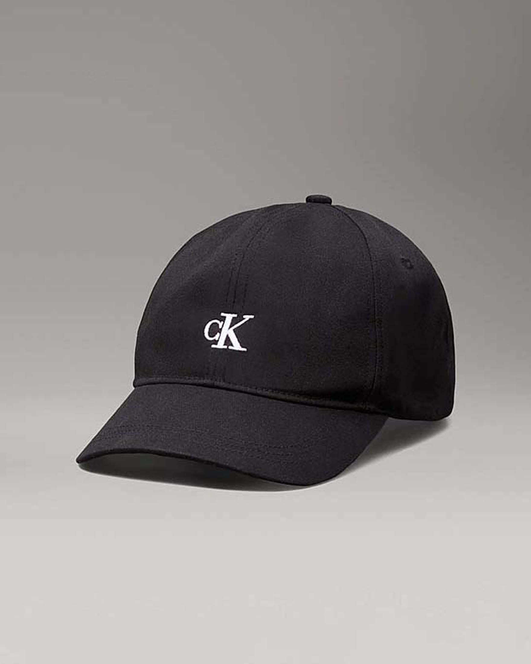 Berretto Calvin Klein nero in cotone con frontino e logo monogramma bianco