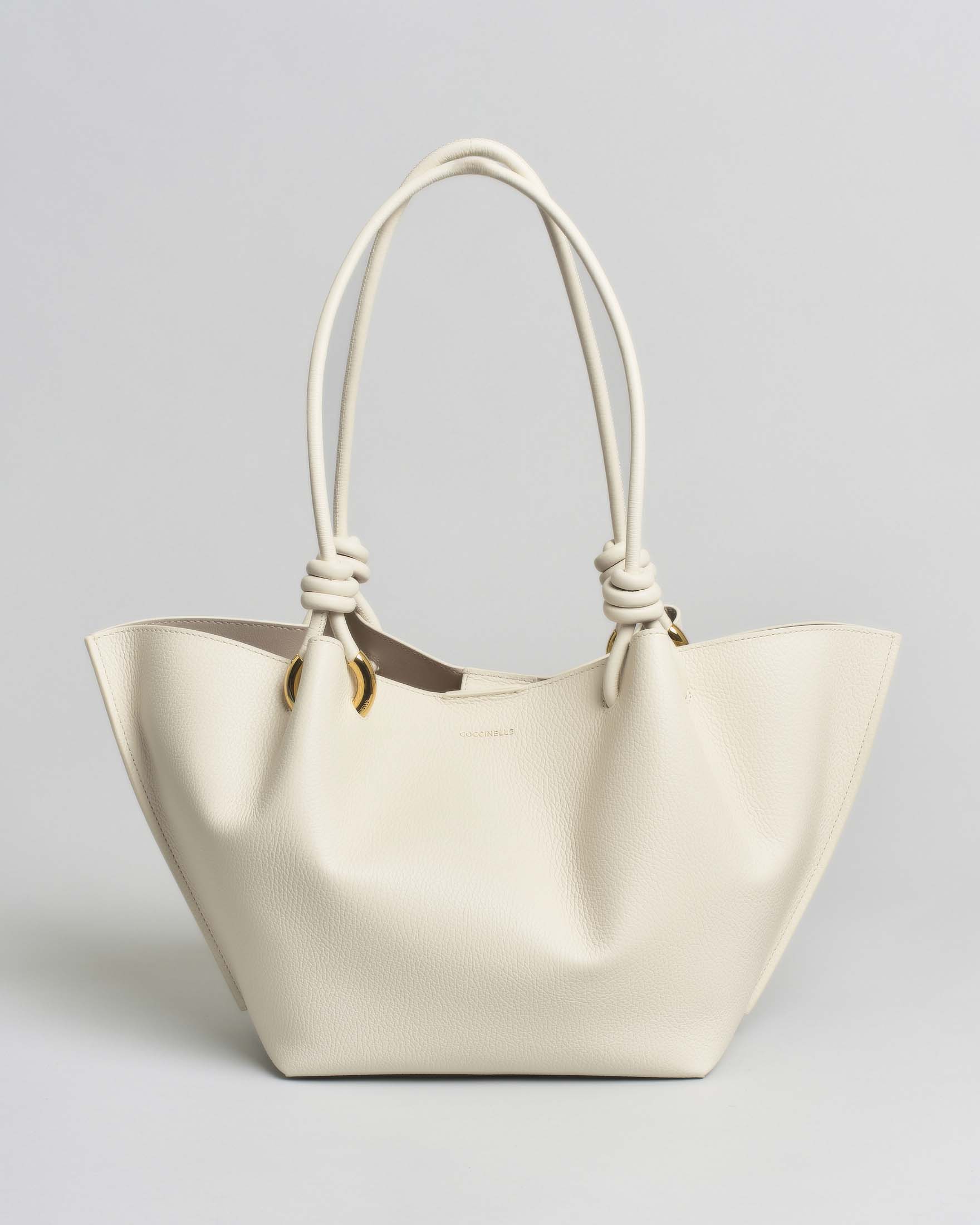 Borsa a mano Coccinelle bianca in pelle granulata con manici e chiusura magnetica