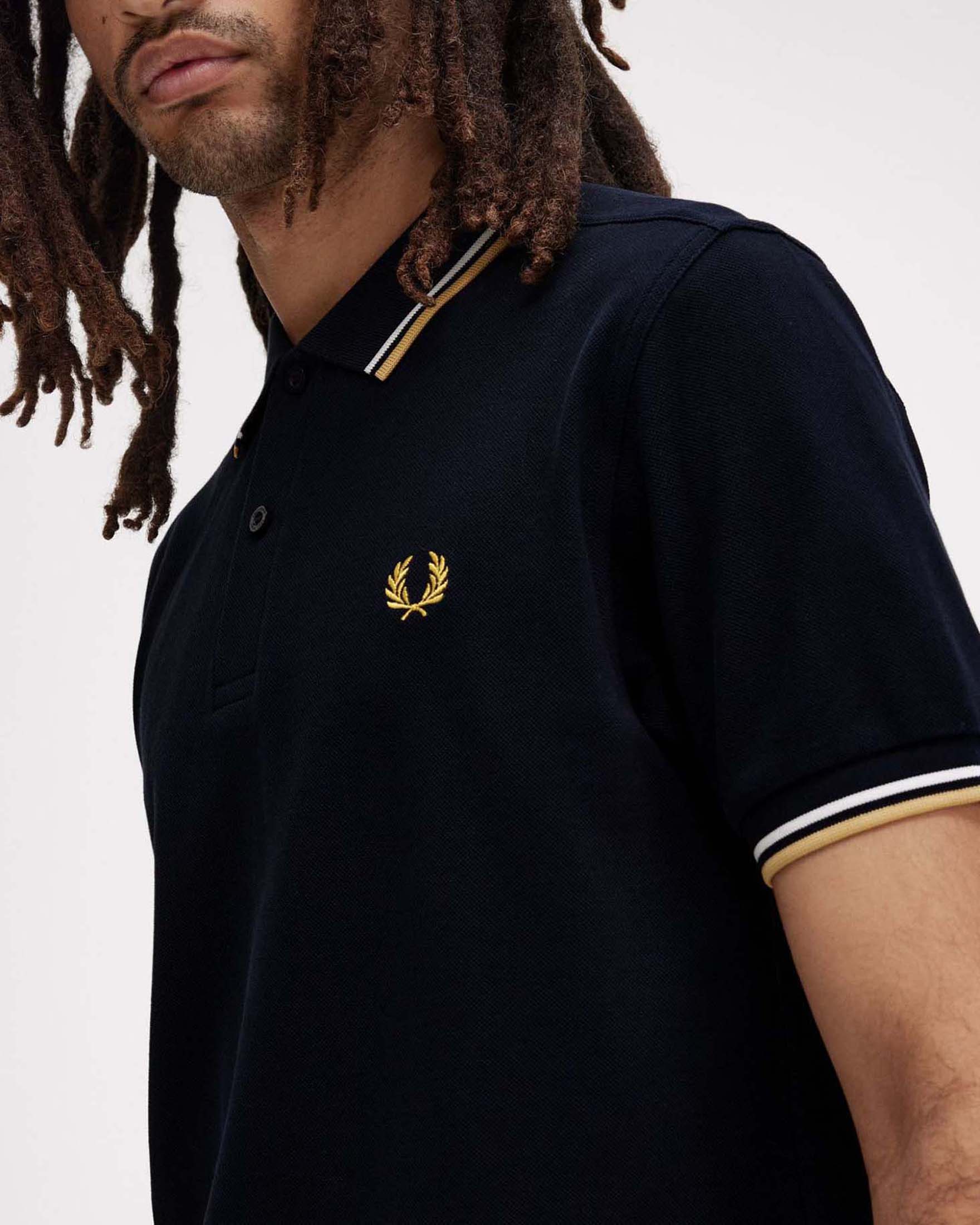 Polo Fred Perry blu mezza manica con bordino bianco e oro