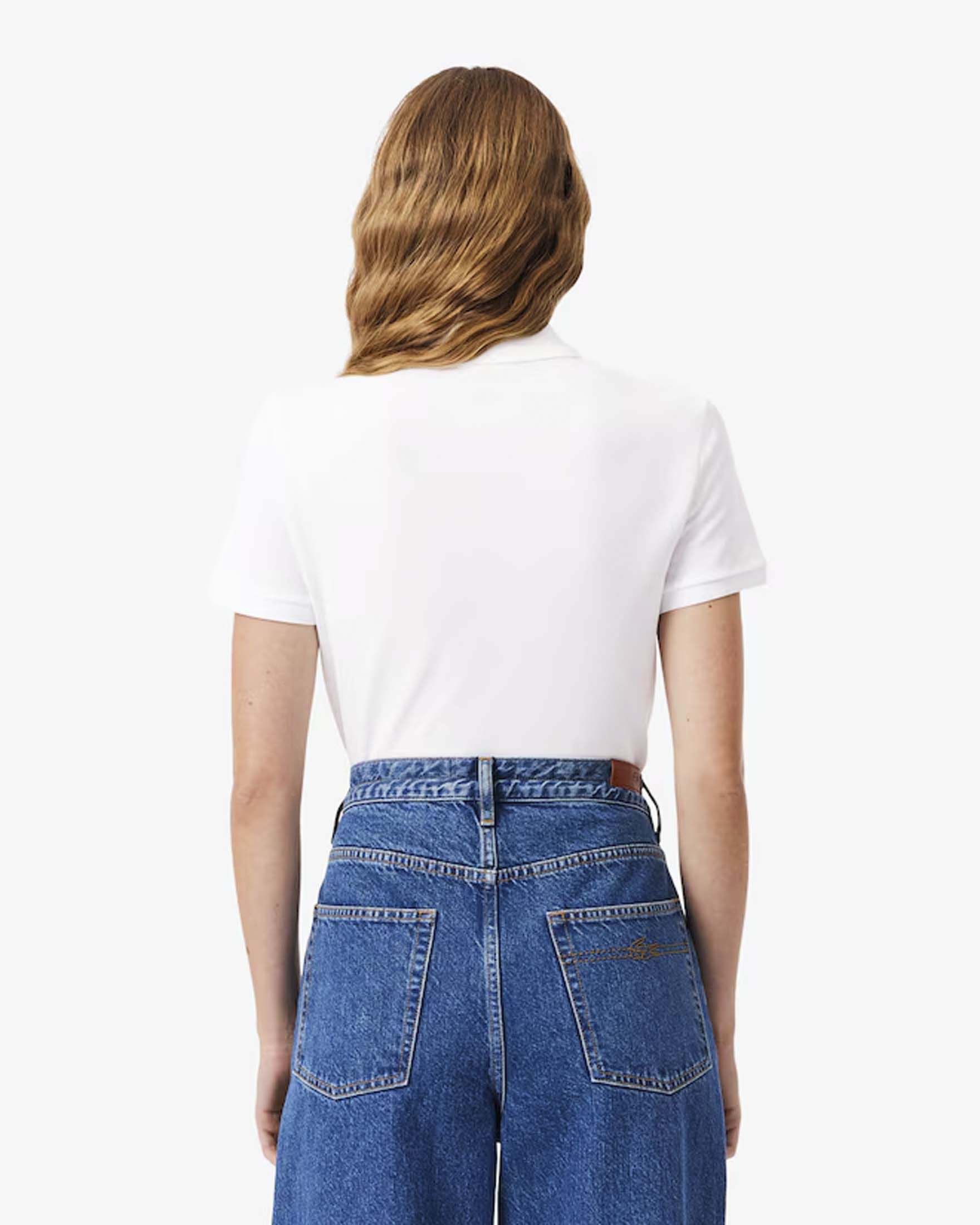 Polo bianca Lacoste in piqué di cotone stretch image