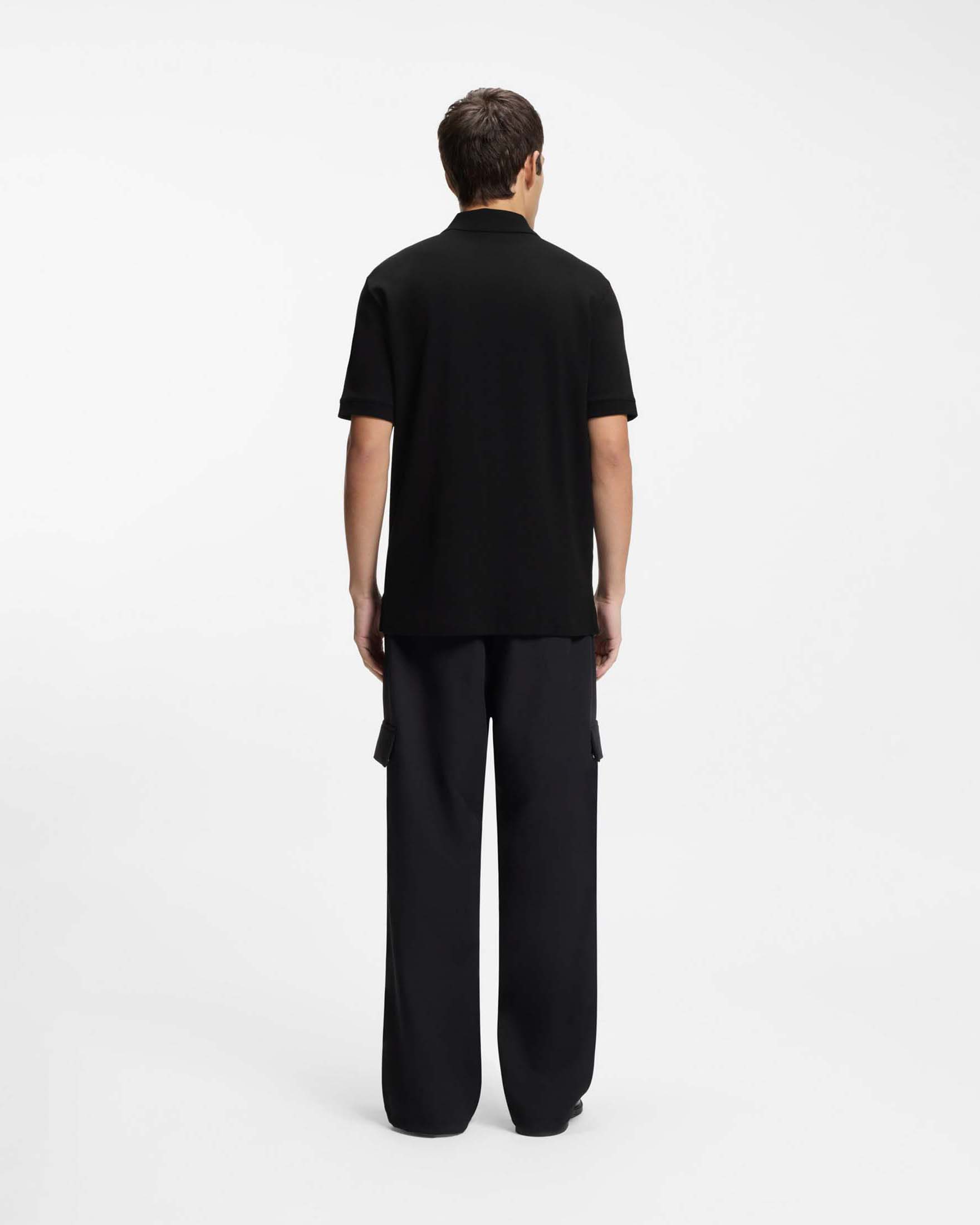 Polo Hugo nera in cotone con zip e logo stampato sul petto image