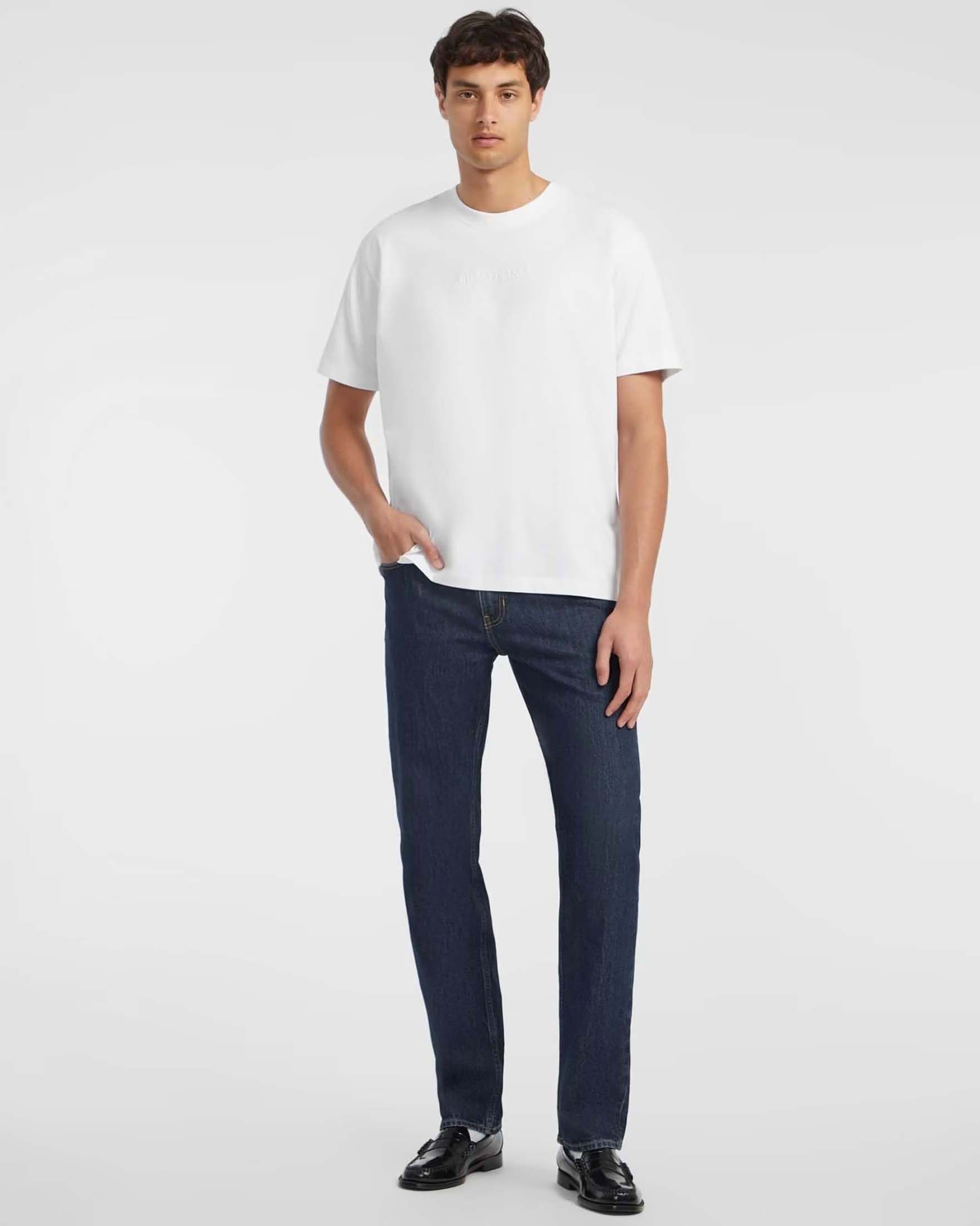 Guess Jeans — T-shirt Guess Jeans relaxed-fit bianca in puro cotone con logo ricamato sul davanti