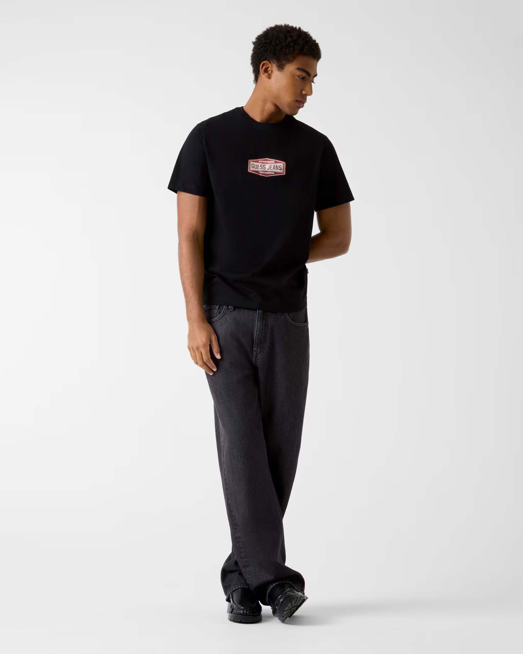 T-shirt Guess Jeans nera in cotone con logo stampato sul petto