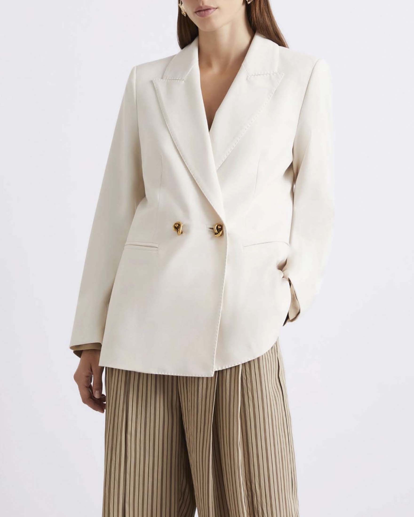 Blazer doppiopetto color panna in tela stretch