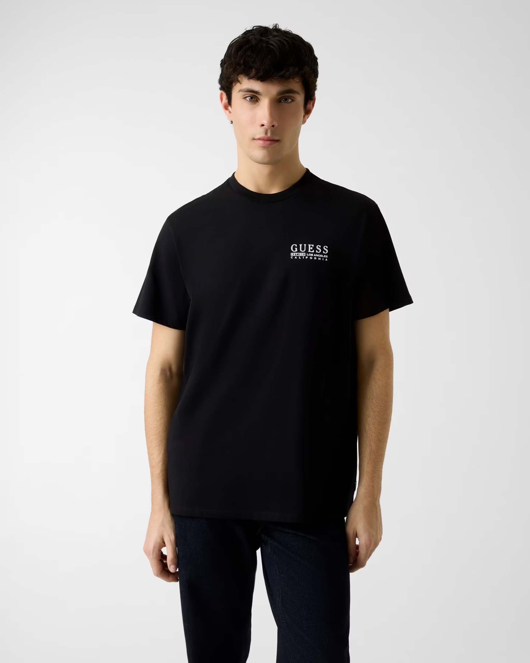 T-shirt Guess nera in cotone biologico con logo stampato sul petto